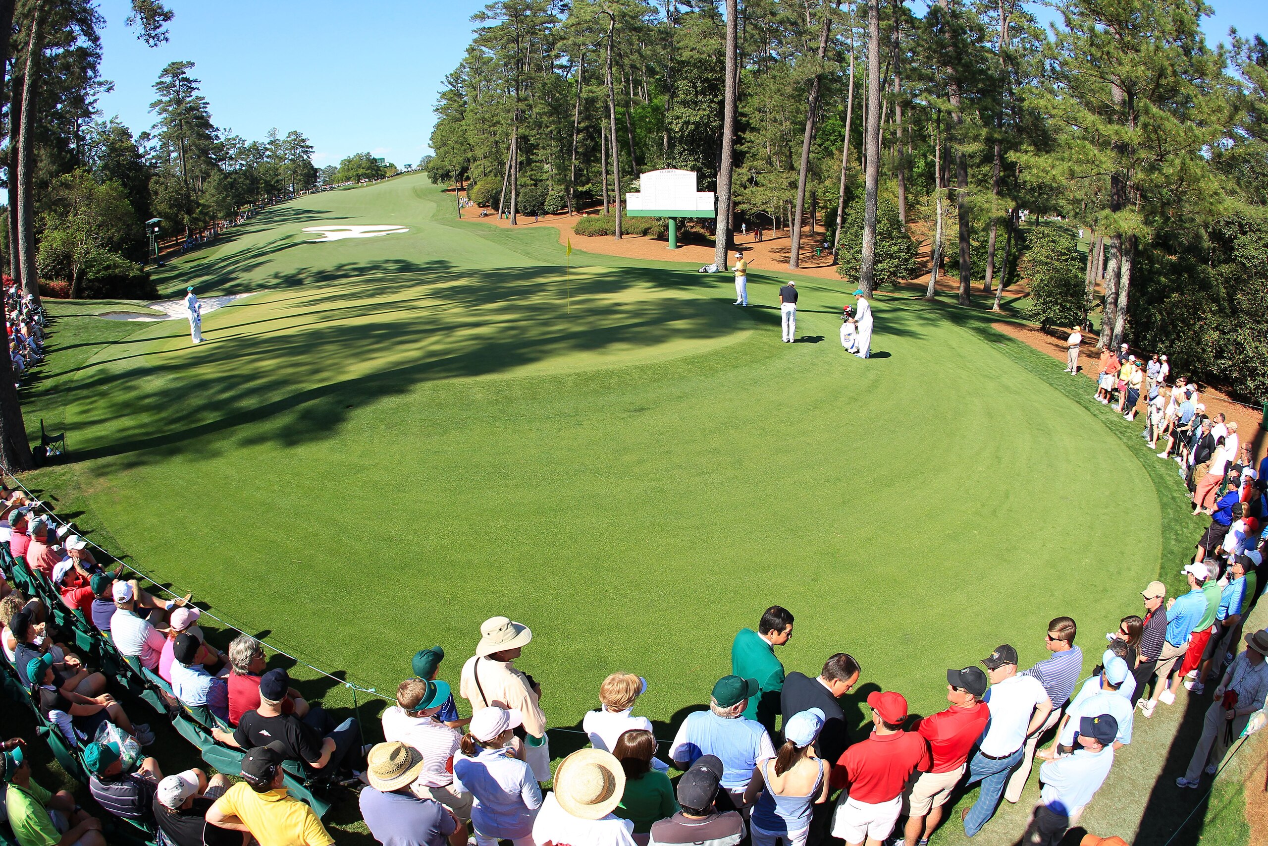 AUGUSTA, GA - APRIL 11:  Patrons watch as Anthony Kim putts on the tenth green during the final round of the 2010 Masters Tournament at Augusta National Golf Club on April 11, 2010 in Augusta, Georgia.  (Photo by David Cannon/Getty Images)