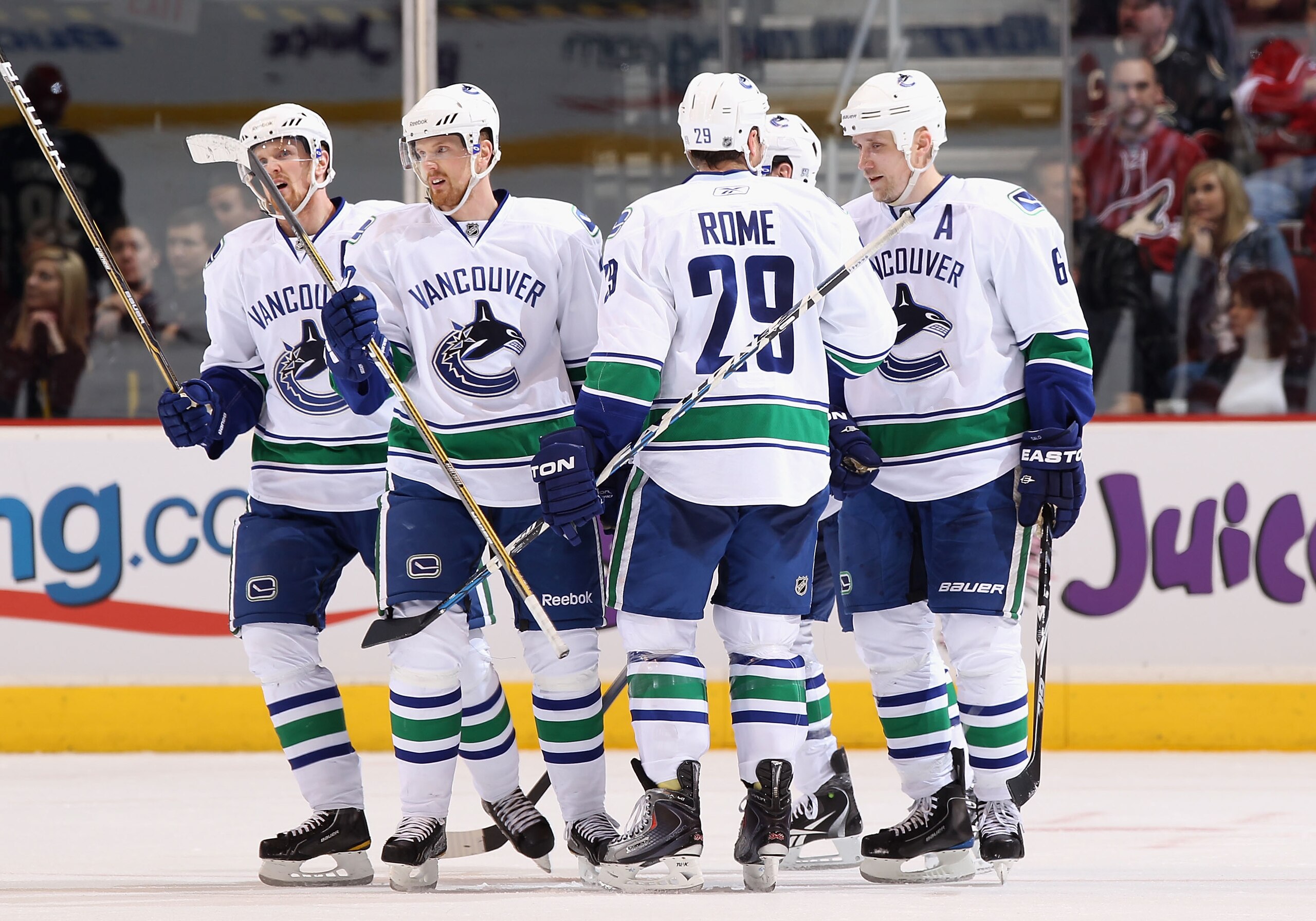 GLENDALE, AZ - MARCH 08: (L-R) Henrik Sedin #33, Daniel Sedin #22, Aaron Rome #29, Alex Burrows #14 and Sami Salo #6 of the Vancouver Canucks celebrate after Salo scored a second period goal against the Phoenix Coyotes during the NHL game at Jobing.com A GLENDALE, AZ - MARCH 08: (L-R) Henrik Sedin #33, Daniel Sedin #22, Aaron Rome #29, Alex Burrows #14 and Sami Salo #6 of the Vancouver Canucks celebrate after Salo scored a second period goal against the Phoenix Coyotes during the NHL game at Jobing.com A