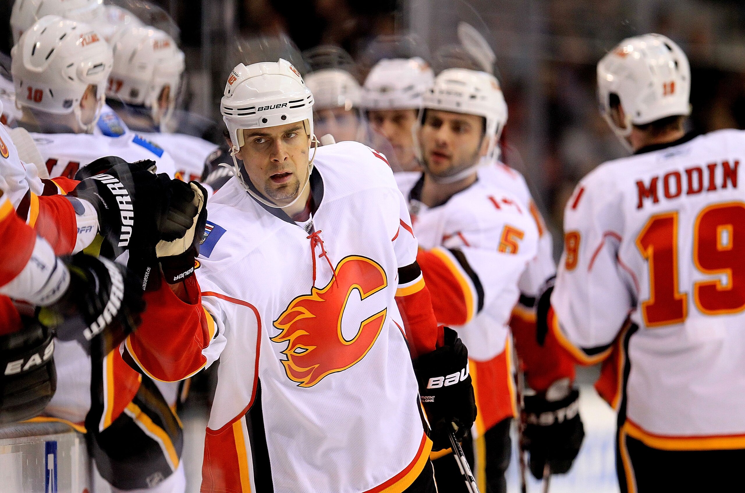 DALLAS, TX - MARCH 09: Right wing Tom Kostopoulos #16 of the Calgary Flames celebrates a goal against the Dallas Stars at American Airlines Center on March 9, 2011 in Dallas, Texas. (Photo by Ronald Martinez/Getty Images) DALLAS, TX - MARCH 09: Right wing Tom Kostopoulos #16 of the Calgary Flames celebrates a goal against the Dallas Stars at American Airlines Center on March 9, 2011 in Dallas, Texas. (Photo by Ronald Martinez/Getty Images)