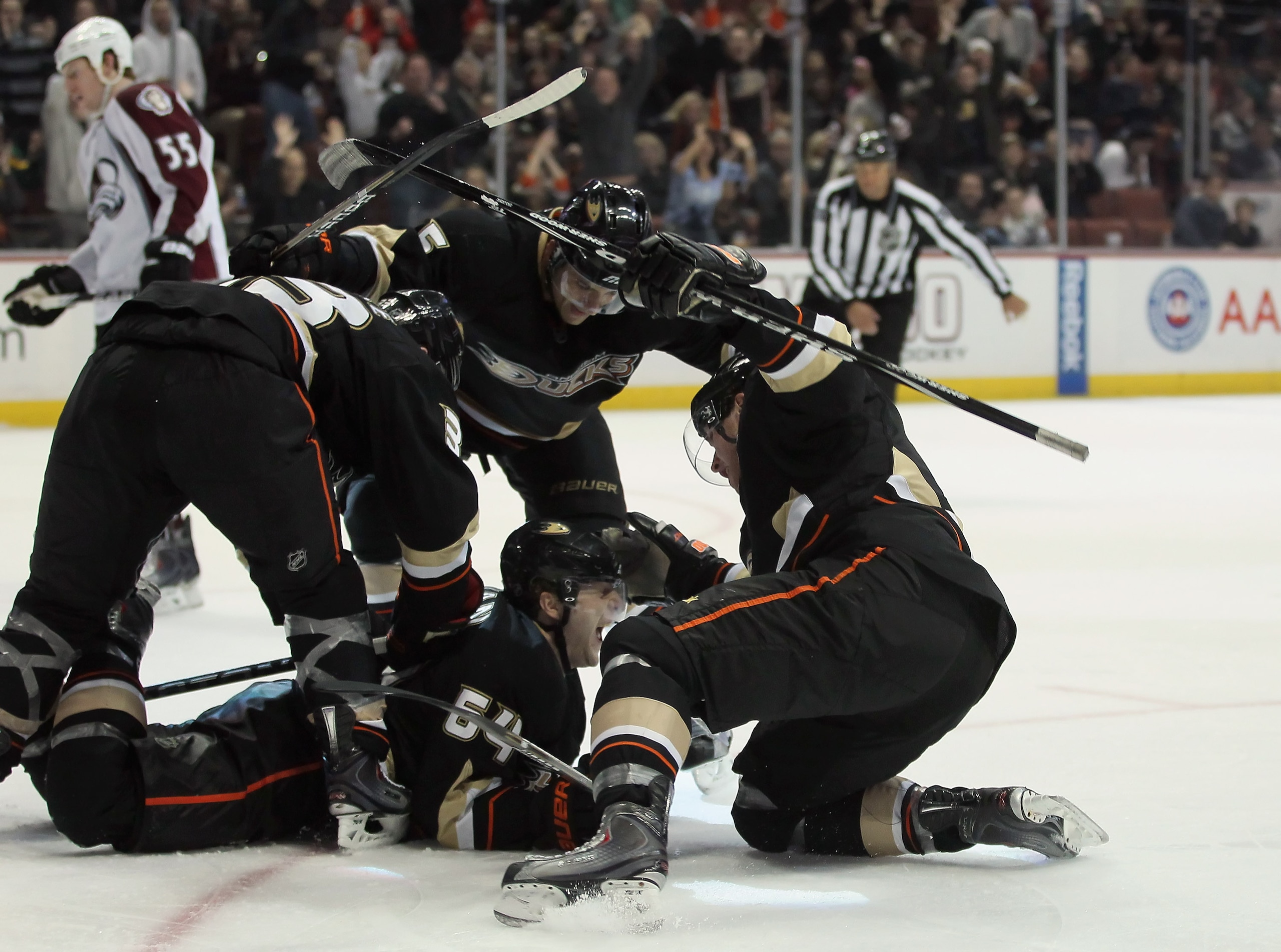 ANAHEIM, CA - FEBRUARY 27: (clockwise from top) Luca Sbisa #5, Bobby Ryan #9, Brandon McMillan #64 and Jason Blake #33 of the Anaheim Ducks celebrate McMillan's go ahead goal in the third period against the Colorado Avalanche at Honda Center on February ANAHEIM, CA - FEBRUARY 27: (clockwise from top) Luca Sbisa #5, Bobby Ryan #9, Brandon McMillan #64 and Jason Blake #33 of the Anaheim Ducks celebrate McMillan's go ahead goal in the third period against the Colorado Avalanche at Honda Center on February