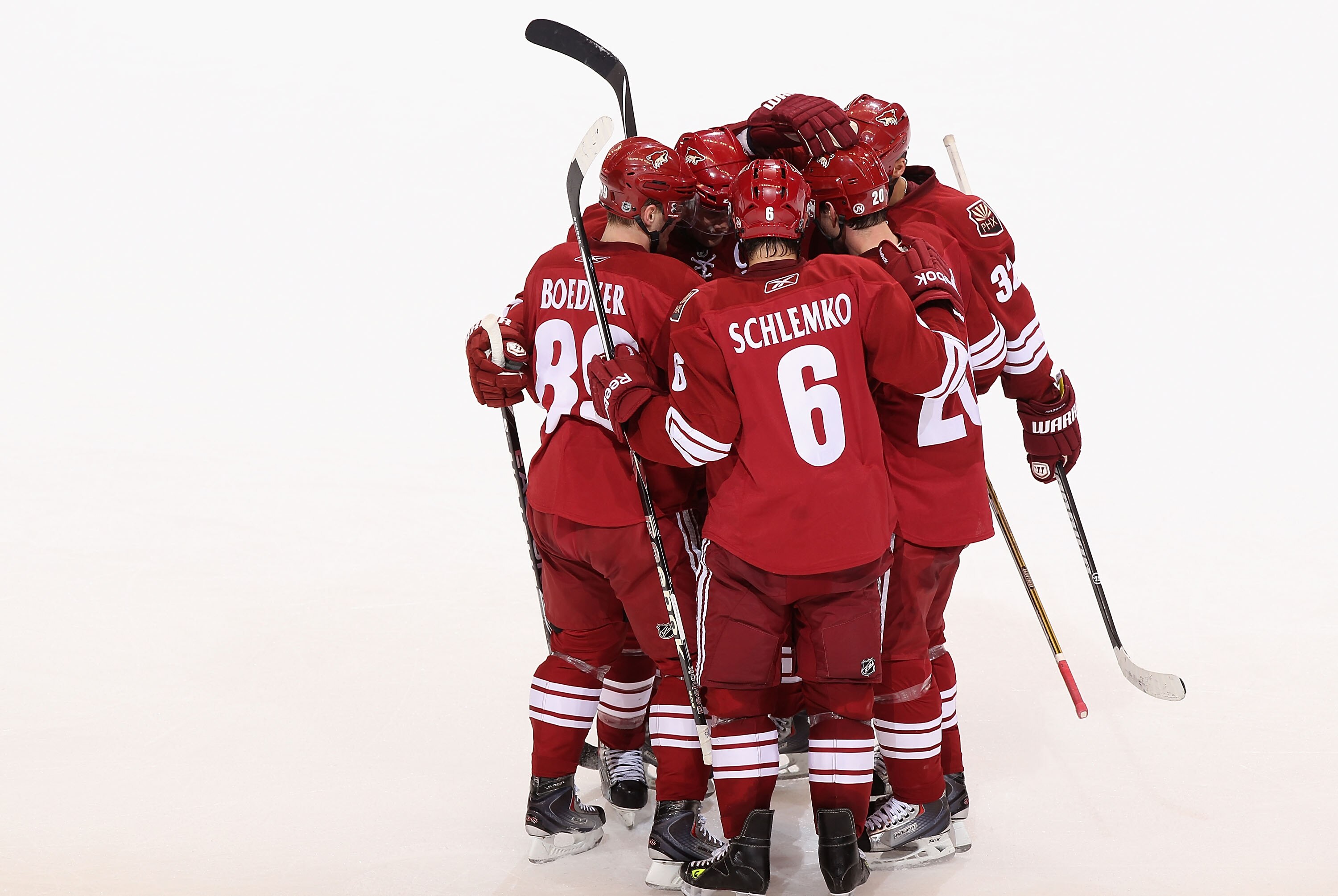 GLENDALE, AZ - MARCH 20:  Eric Belanger #20 of the Phoenix Coyotes celebrates with teammates after scoring a second period goal against the Chicago Blackhawks during the NHL game at Jobing.com Arena on March 20, 2011 in Glendale, Arizona.  (Photo by Chris