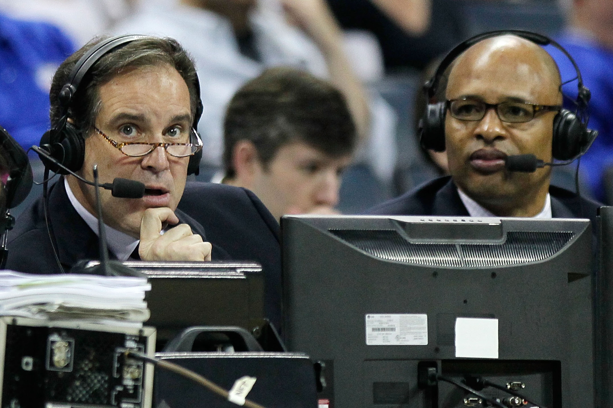 CHARLOTTE, NC - MARCH 18:  Broadcasters Jim Nantz and Clark Kellogg speak during the second round of the 2011 NCAA men's basketball tournament between the Michigan Wolverines and Tennessee Volunteers at Time Warner Cable Arena on March 18, 2011 in Charlot