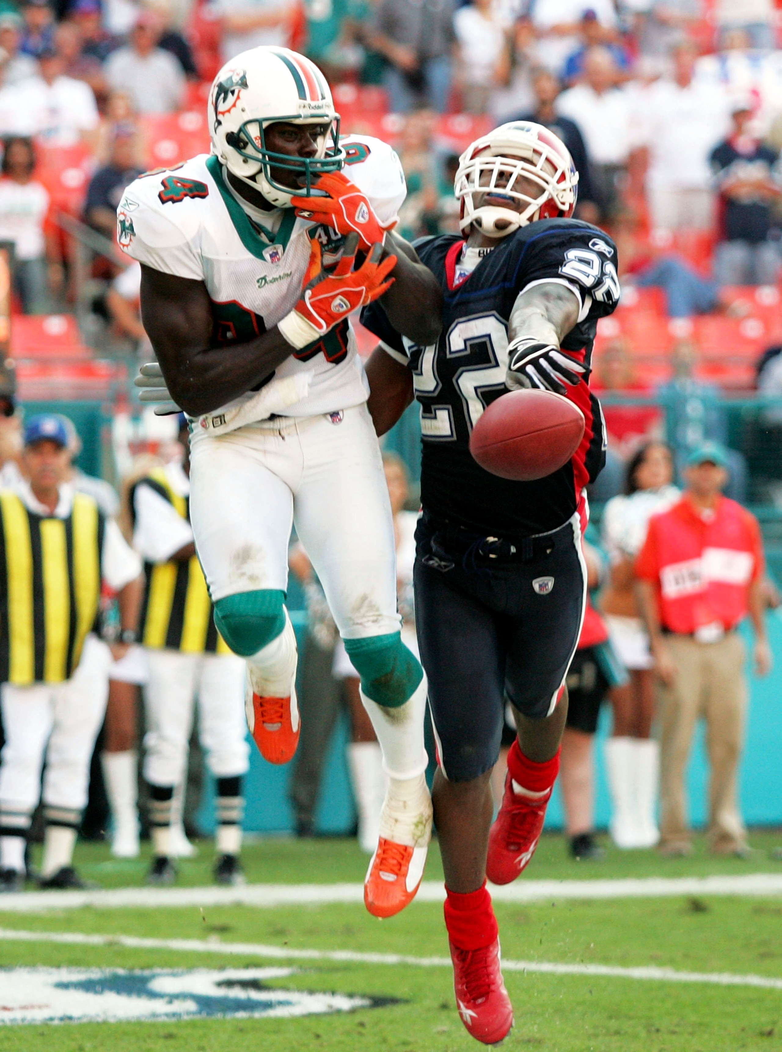 MIAMI - DECEMBER 04: Wide receiver Chris Chambers #84 of the Miami Dolphins can't quite haul in a touchdown catch as the ball is knocked down by defensive back Nate Clements #22 of the Buffalo Bills on December 4, 2005 at Dolphins Stadium in Miami, Florid
