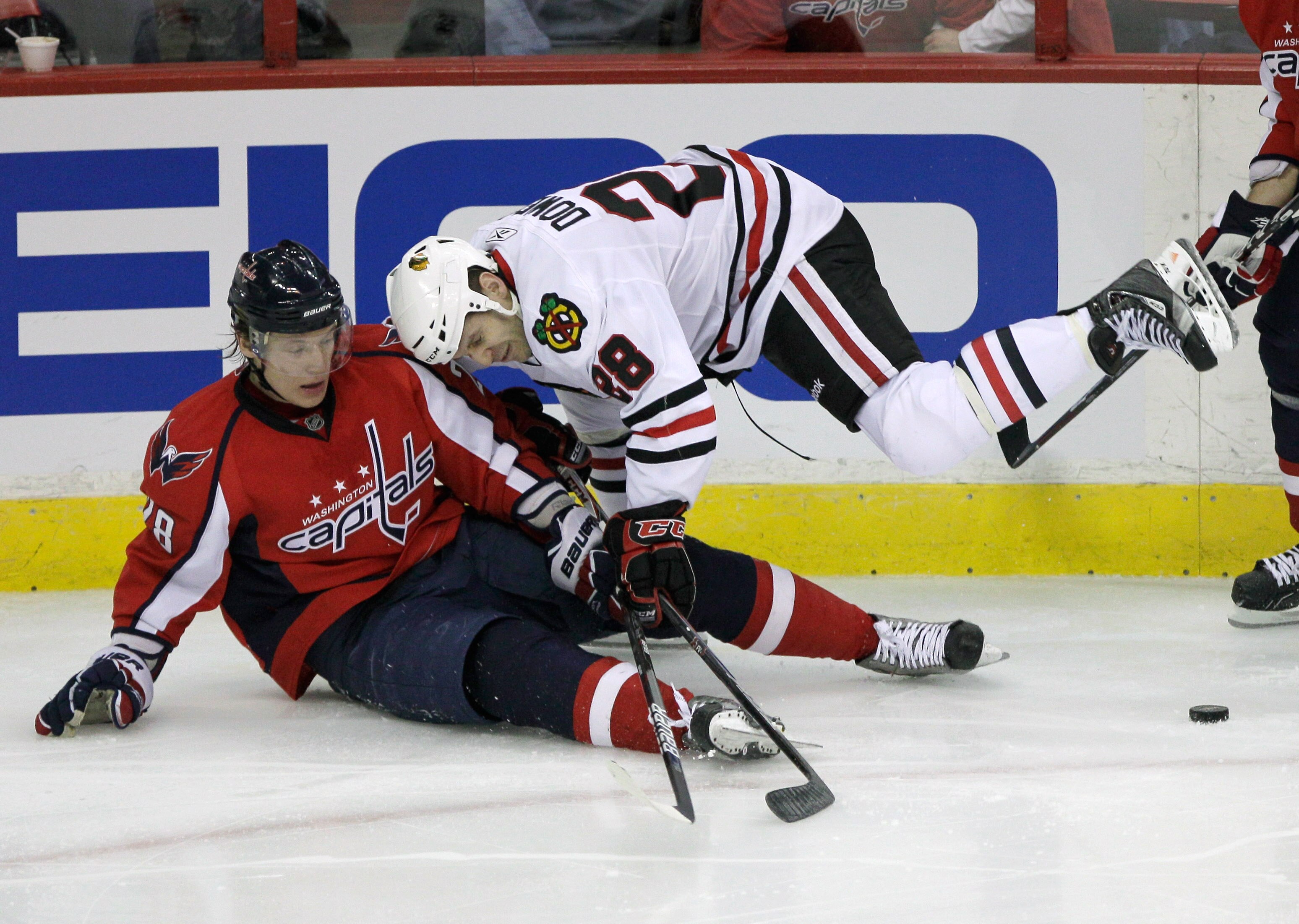 WASHINGTON, DC - MARCH 13:  Alexander Semin # 28 of the Washington Capitals and Jake Dowell #28 of the Chicago Blackhawks collide at the Verizon Center on March 13, 2011 in Washington, DC.  (Photo by Rob Carr/Getty Images)