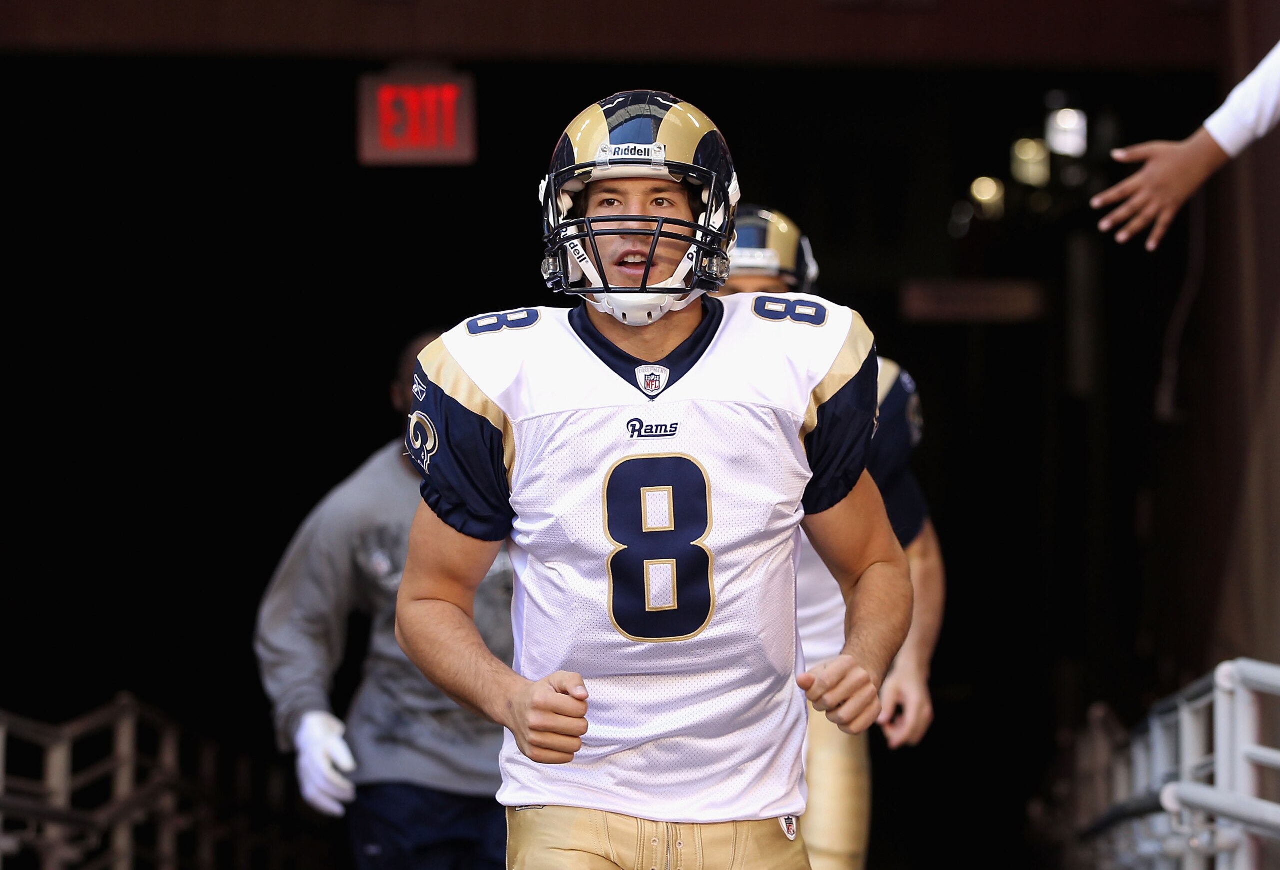 GLENDALE, AZ - DECEMBER 05:  Quarterback Sam Bradford #8 of the St. Louis Rams runs out onto the field before the NFL game against the Arizona Cardinals at the University of Phoenix Stadium on December 5, 2010 in Glendale, Arizona. The Rams defeated the C