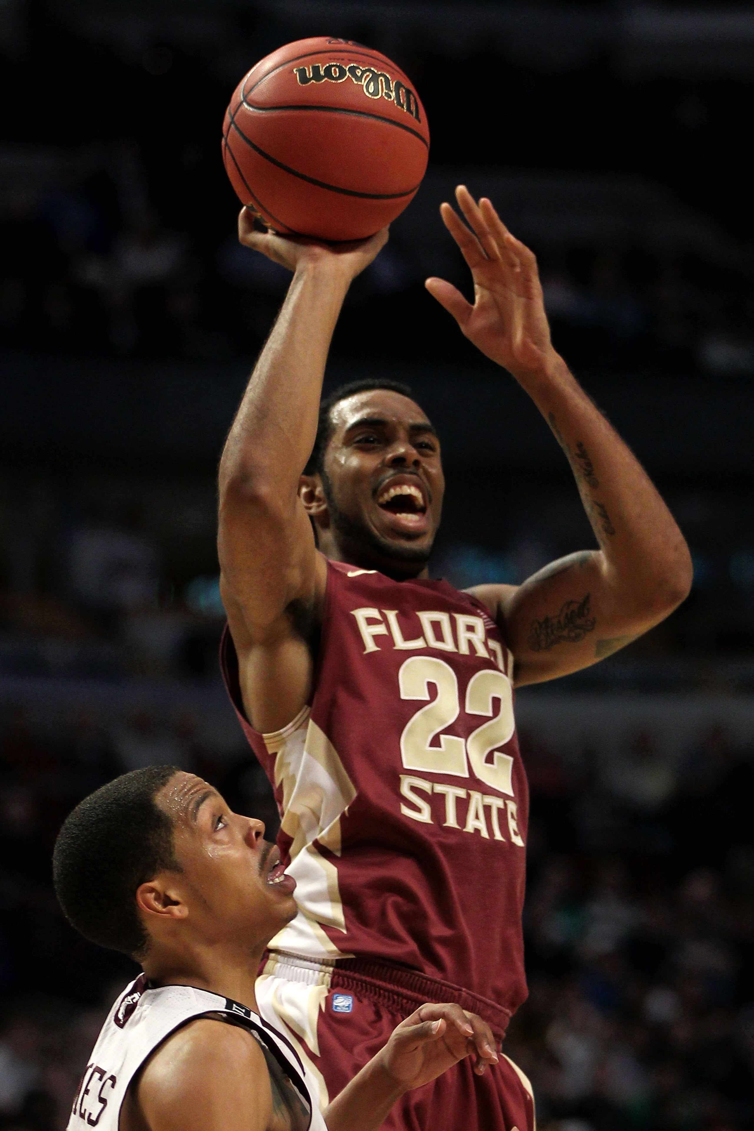 CHICAGO, IL - MARCH 18:  Derwin Kitchen #22 of the Florida State Seminoles shoots against B.J. Holmes #11 of the Texas A&M Aggies in the first half during the second round of the 2011 NCAA men's basketball tournament at the United Center on March 18, 2011