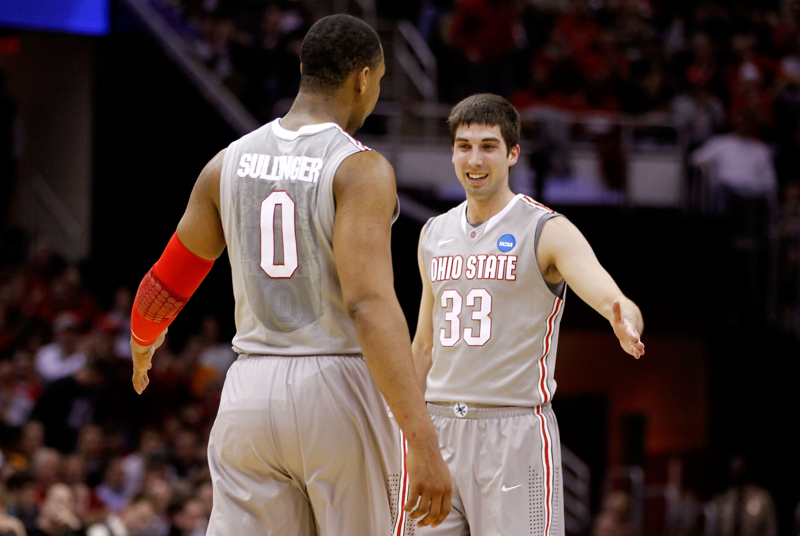CLEVELAND, OH - MARCH 20: Jared Sullinger #0 and Jon Diebler #33 of the Ohio State Buckeyes celebrate after a play in the first half against the George Mason Patriots during the third of the 2011 NCAA men's basketball tournament at Quicken Loans Arena on