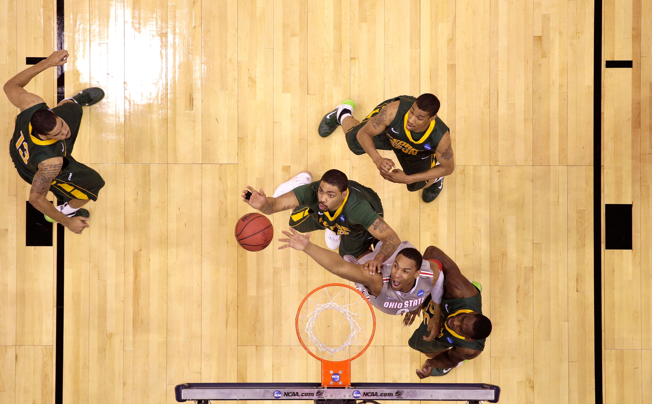 CLEVELAND, OH - MARCH 20: Jared Sullinger #0 of the Ohio State Buckeyes and Ryan Pearson #24 of the George Mason Patriots fight for a rebound during the third of the 2011 NCAA men's basketball tournament at Quicken Loans Arena on March 20, 2011 in Clevela