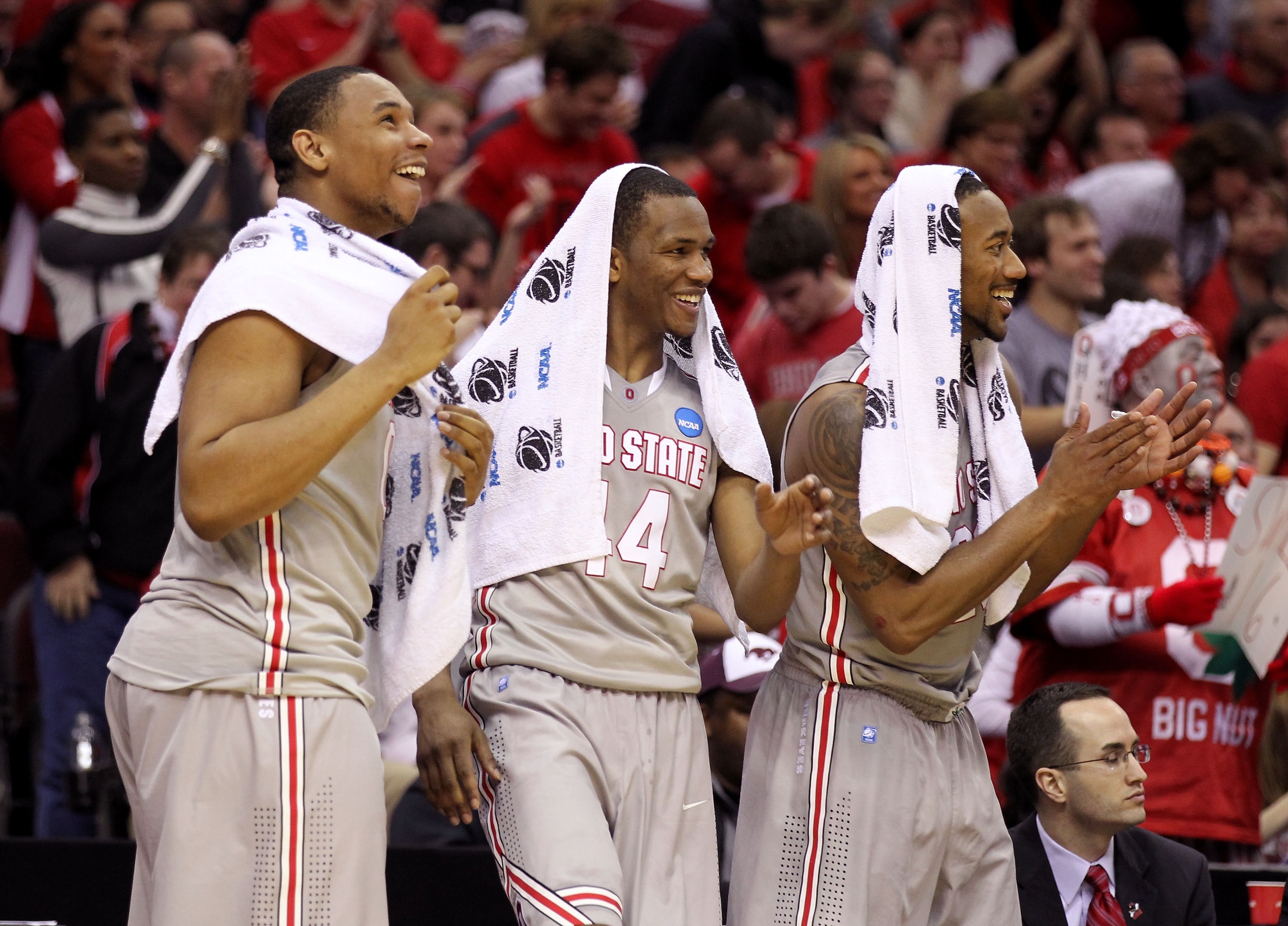 CLEVELAND, OH - MARCH 20:  Jared Sullinger #0, William Buford #44 and David Lighty #23 of the Ohio State Buckeyes look on from the bench during the second half against the George Mason Patriots during the third of the 2011 NCAA men's basketball tournament