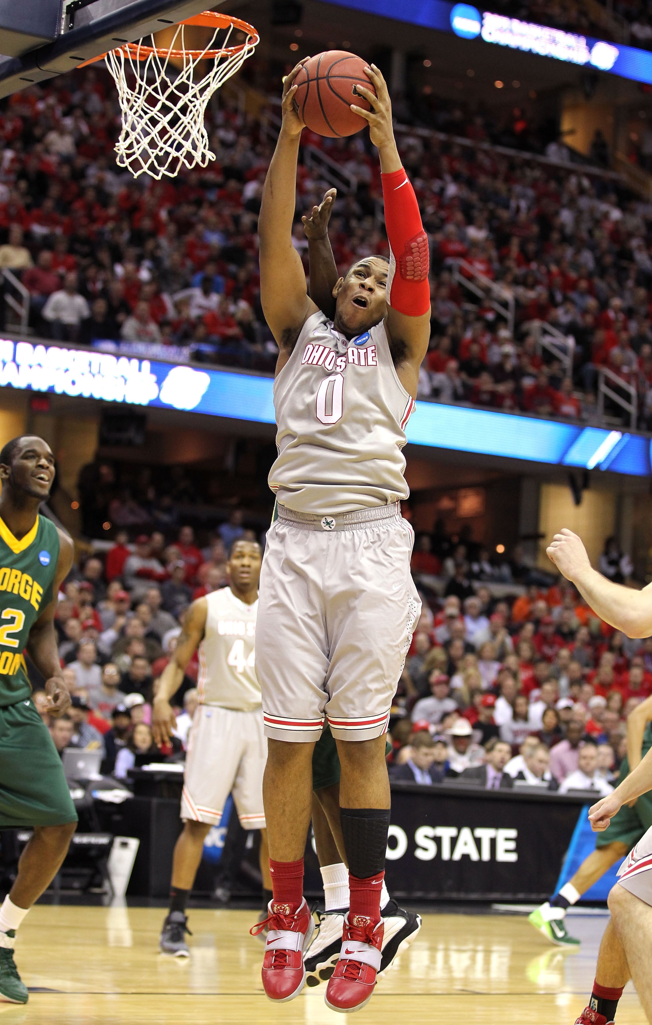 CLEVELAND, OH - MARCH 20: Jared Sullinger #0 of the Ohio State Buckeyes gets a rebound against the George Mason Patriots during the third of the 2011 NCAA men's basketball tournament at Quicken Loans Arena on March 20, 2011 in Cleveland, Ohio.  (Photo by
