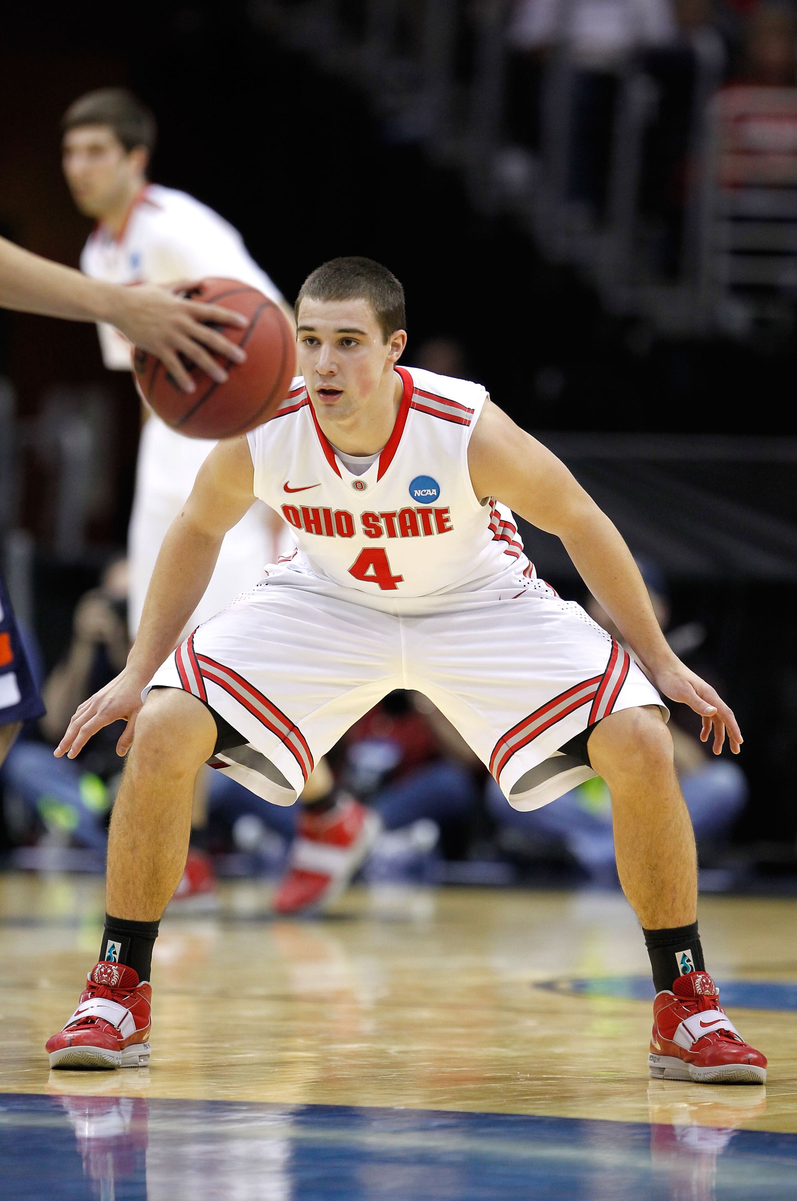 CLEVELAND, OH - MARCH 18: Aaron Craft #4 of the Ohio State Buckeyes prepares to defend a Texas-San Antonio Roadrunners player during the second round of the 2011 NCAA men's basketball tournament at Quicken Loans Arena on March 18, 2011 in Cleveland, Ohio.
