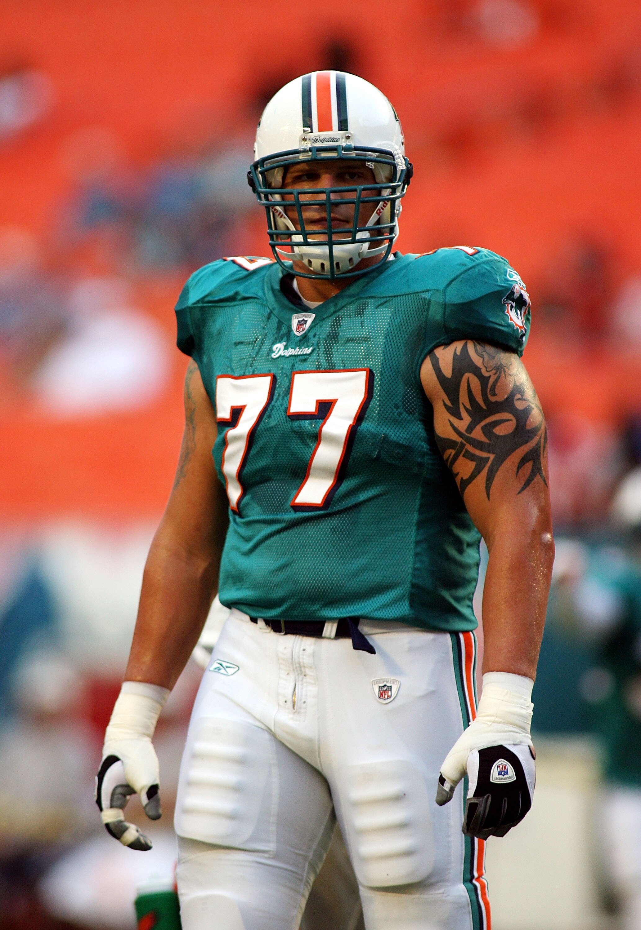 MIAMI - AUGUST 23:  Offensive lineman Jake Long #77 of the Miami Dolphins warms up prior to a pre season game against the Kansas City Chiefs on August 23, 2008 at Dolphin Stadium in Miami, Florida.  (Photo by Marc Serota/Getty Images)