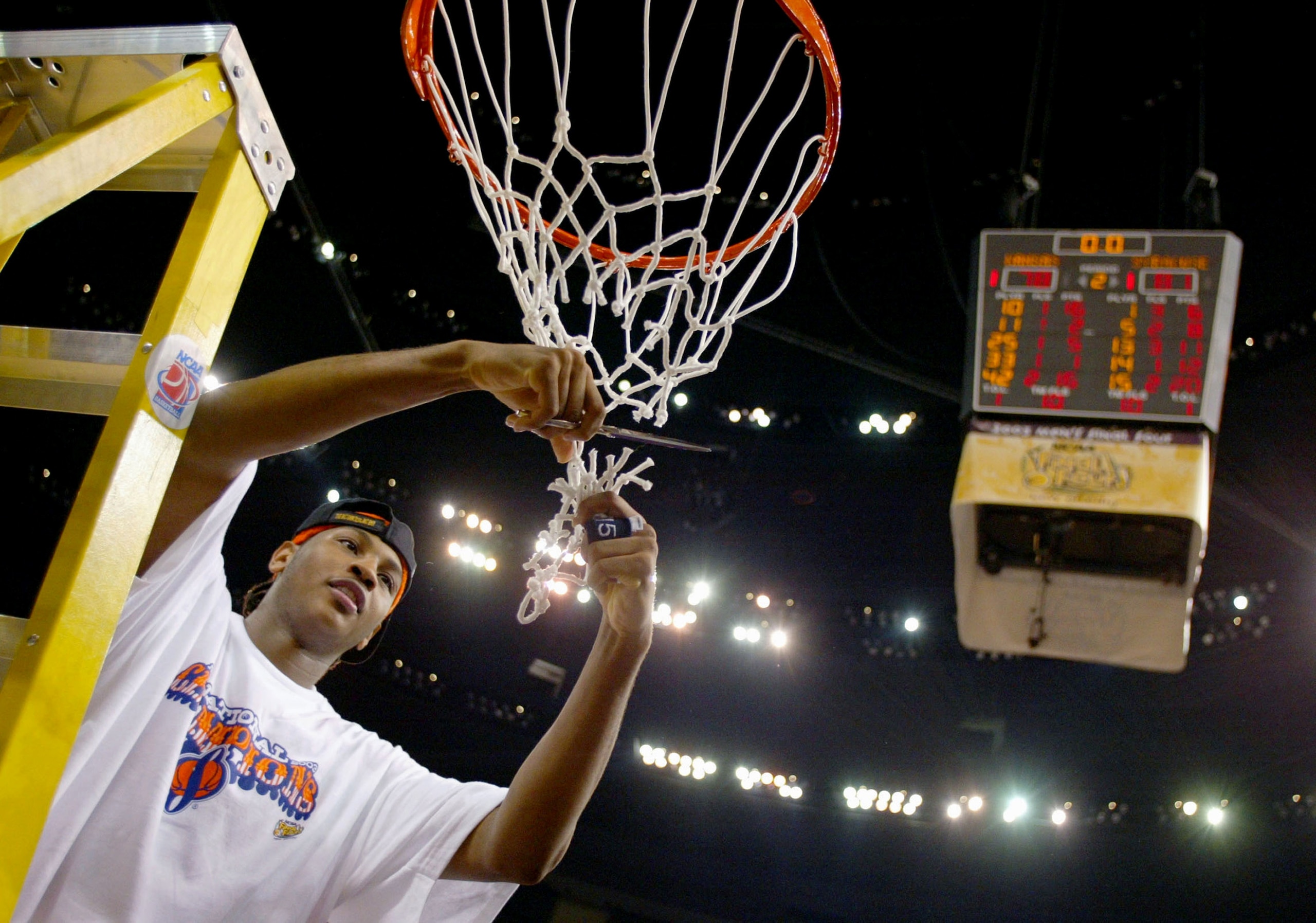 NEW ORLEANS - APRIL 7:  Carmelo Anthony #15 of Syracuse cuts down the net after he and his team defeated Kansas 81-78 during the championship game of the NCAA Men's Final Four Tournament on April 7, 2003 at the Louisiana Superdome in New Orleans, Louisian
