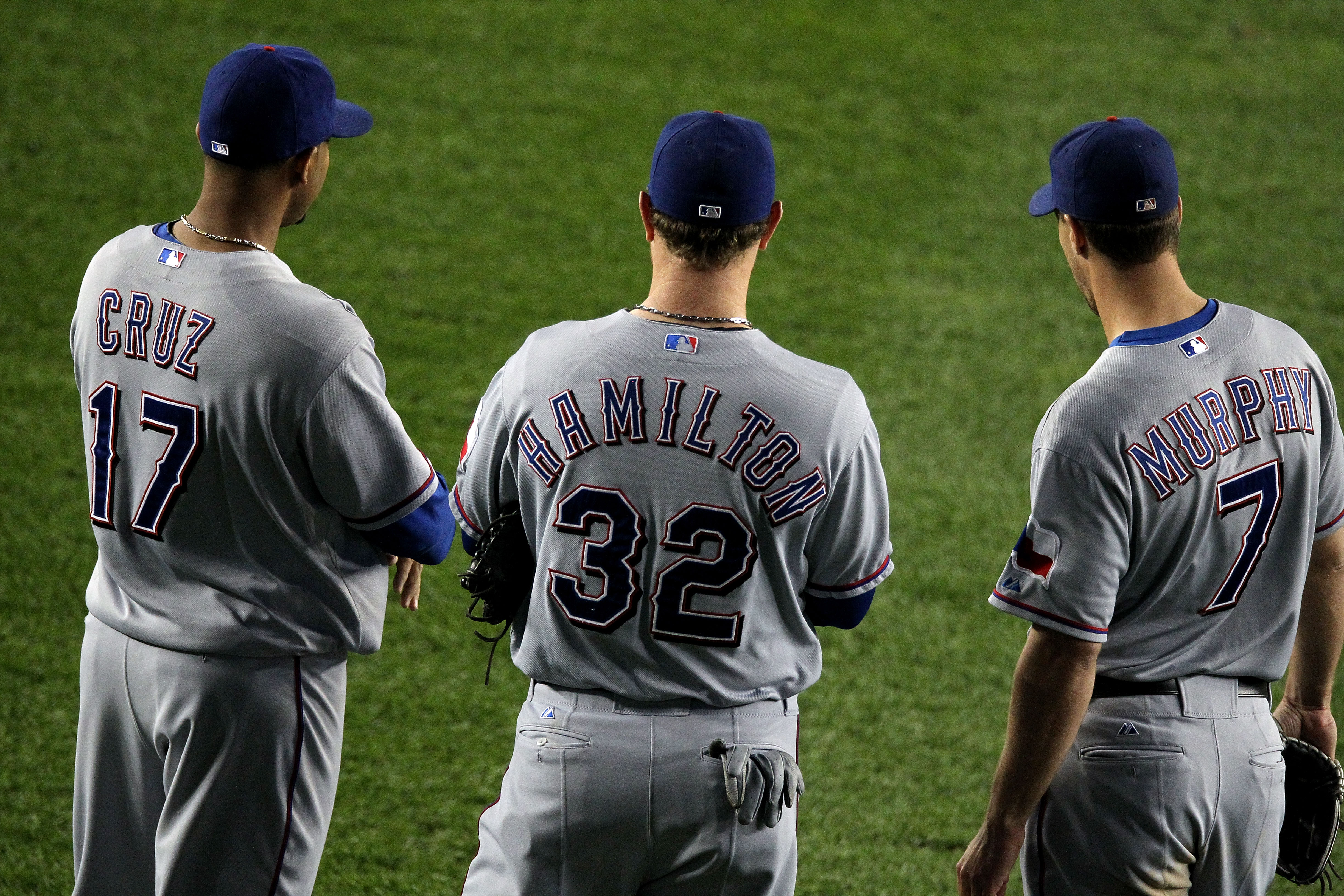 NEW YORK - OCTOBER 19:  Nelson Cruz #17, Josh Hamilton #32 and David Murphy #7 of the Texas Rangers look on against the New York Yankees in Game Four of the ALCS during the 2010 MLB Playoffs at Yankee Stadium on October 19, 2010 in the Bronx borough of Ne