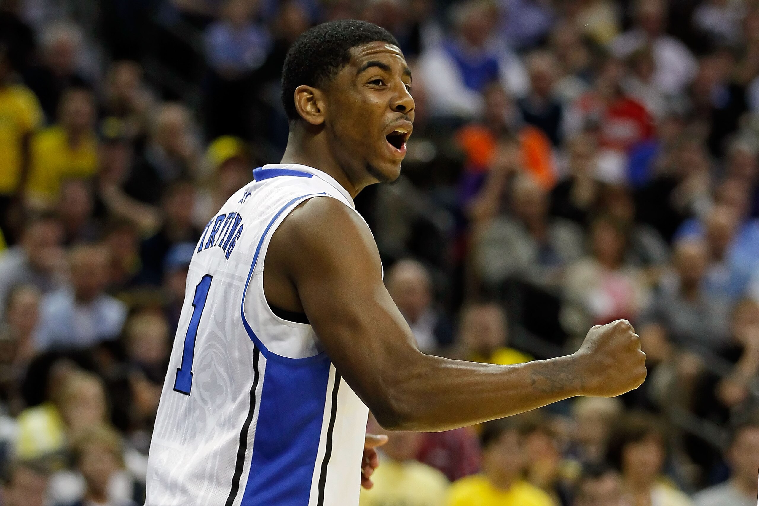 CHARLOTTE, NC - MARCH 20: Kyrie Irving #1 of the Duke Blue Devils reacts in the first half while taking on the Michigan Wolverines during the third round of the 2011 NCAA men's basketball tournament at Time Warner Cable Arena on March 20, 2011 in Charlot CHARLOTTE, NC - MARCH 20: Kyrie Irving #1 of the Duke Blue Devils reacts in the first half while taking on the Michigan Wolverines during the third round of the 2011 NCAA men's basketball tournament at Time Warner Cable Arena on March 20, 2011 in Charlot