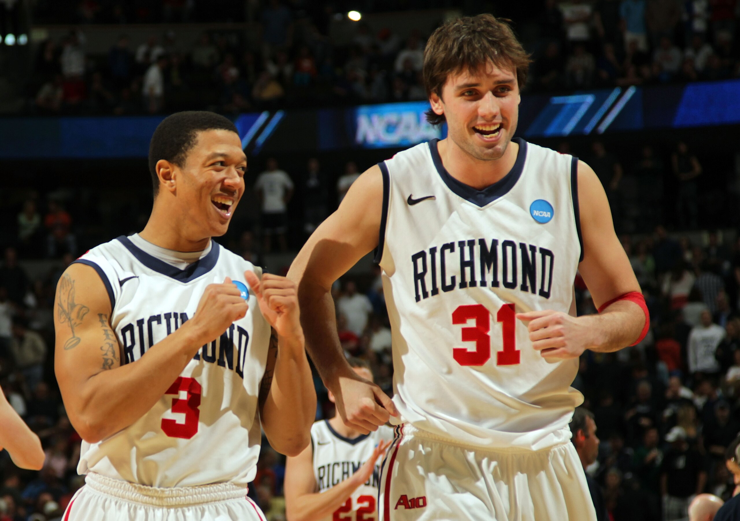 DENVER, CO - MARCH 19: Darien Brothers #3 and Conor Smith #31 of the Richmond Spiders celebrate after defeating the Morehead State Eagles during the third round of the 2011 NCAA men's basketball tournament at Pepsi Center on March 19, 2011 in Denver, Col DENVER, CO - MARCH 19: Darien Brothers #3 and Conor Smith #31 of the Richmond Spiders celebrate after defeating the Morehead State Eagles during the third round of the 2011 NCAA men's basketball tournament at Pepsi Center on March 19, 2011 in Denver, Col