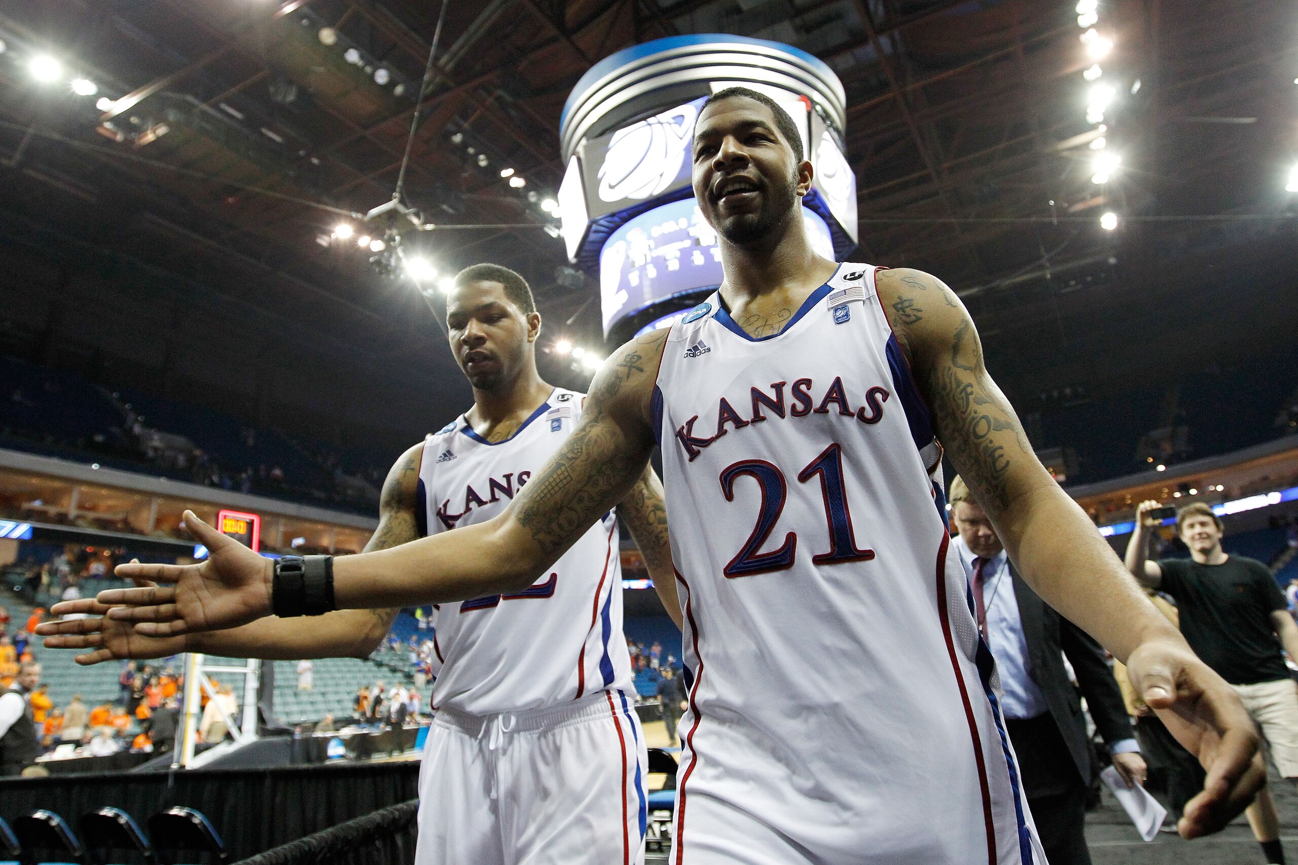 TULSA, OK - MARCH 20: Marcus Morris #22 and Markieff Morris #21 of the Kansas Jayhawks walk off the court after defeating the Illinois Fighting Illini 59-73 in the third round of the 2011 NCAA men's basketball tournament at BOK Center on March 20, 2011 i TULSA, OK - MARCH 20: Marcus Morris #22 and Markieff Morris #21 of the Kansas Jayhawks walk off the court after defeating the Illinois Fighting Illini 59-73 in the third round of the 2011 NCAA men's basketball tournament at BOK Center on March 20, 2011 i