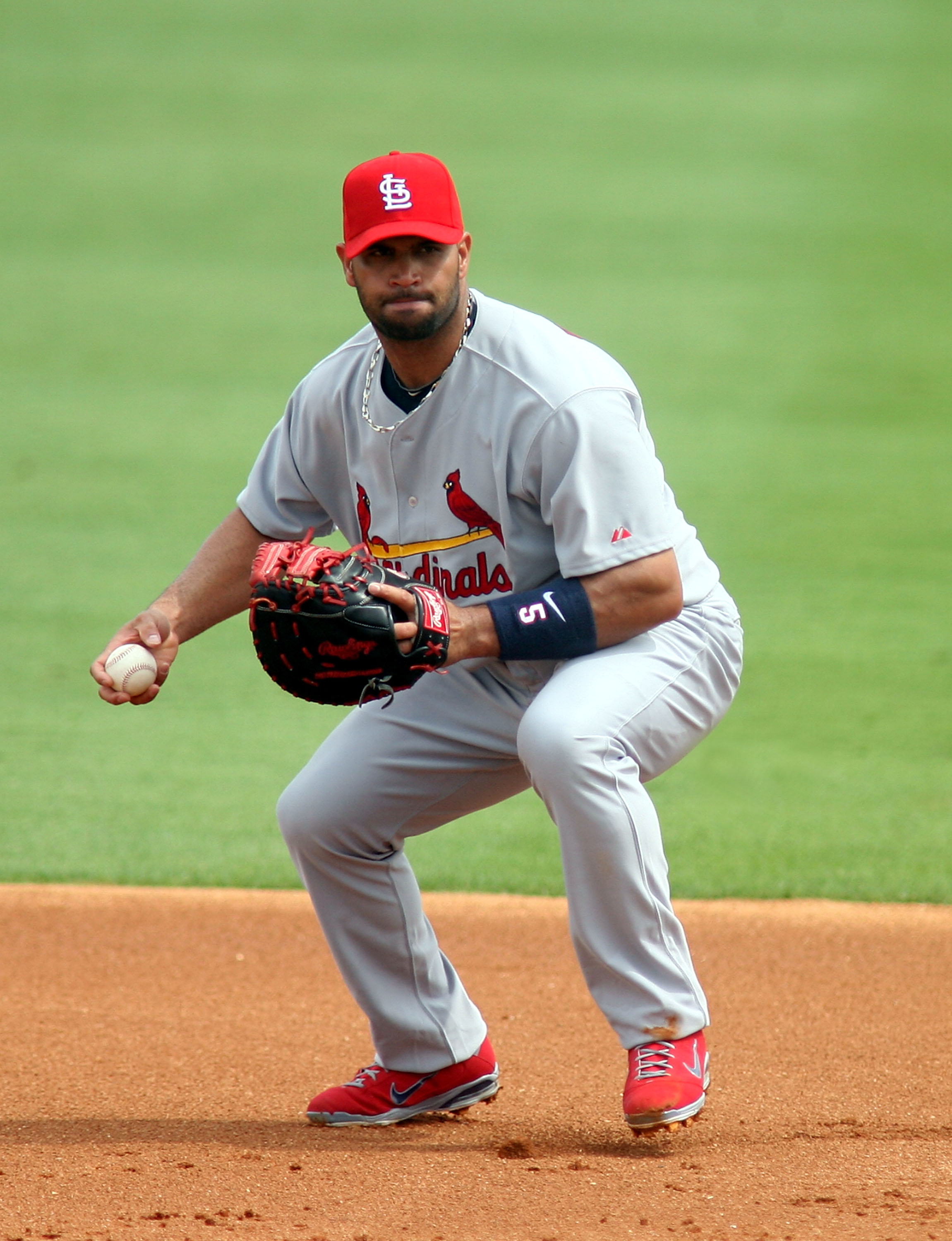 JUPITER, FL - MARCH 06:  First baseman Albert Pujols #5 of the St. Louis Cardinals plays against the Florida Marlins at Roger Dean Stadium on March 6, 2011 in Jupiter, Florida.  (Photo by Marc Serota/Getty Images)