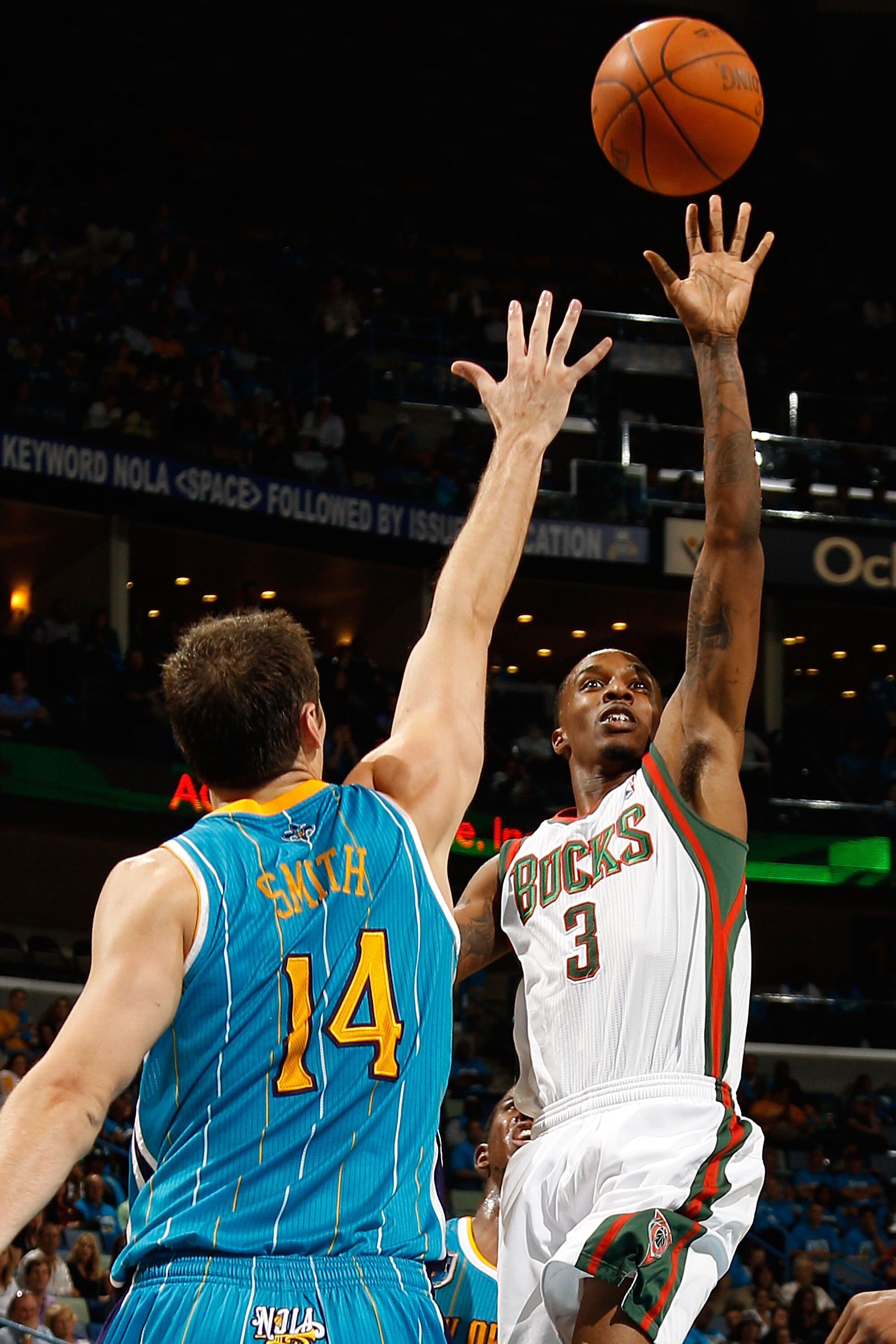 NEW ORLEANS - OCTOBER 27:  Brandon Jennings #3 of the Milwaukee Bucks shoots the ball over Jason Smith #14 of the New Orleans Hornets at the New Orleans Arena on October 27, 2010 in New Orleans, Louisiana.   The Hornets defeated the Bucks 95-91.   NOTE TO