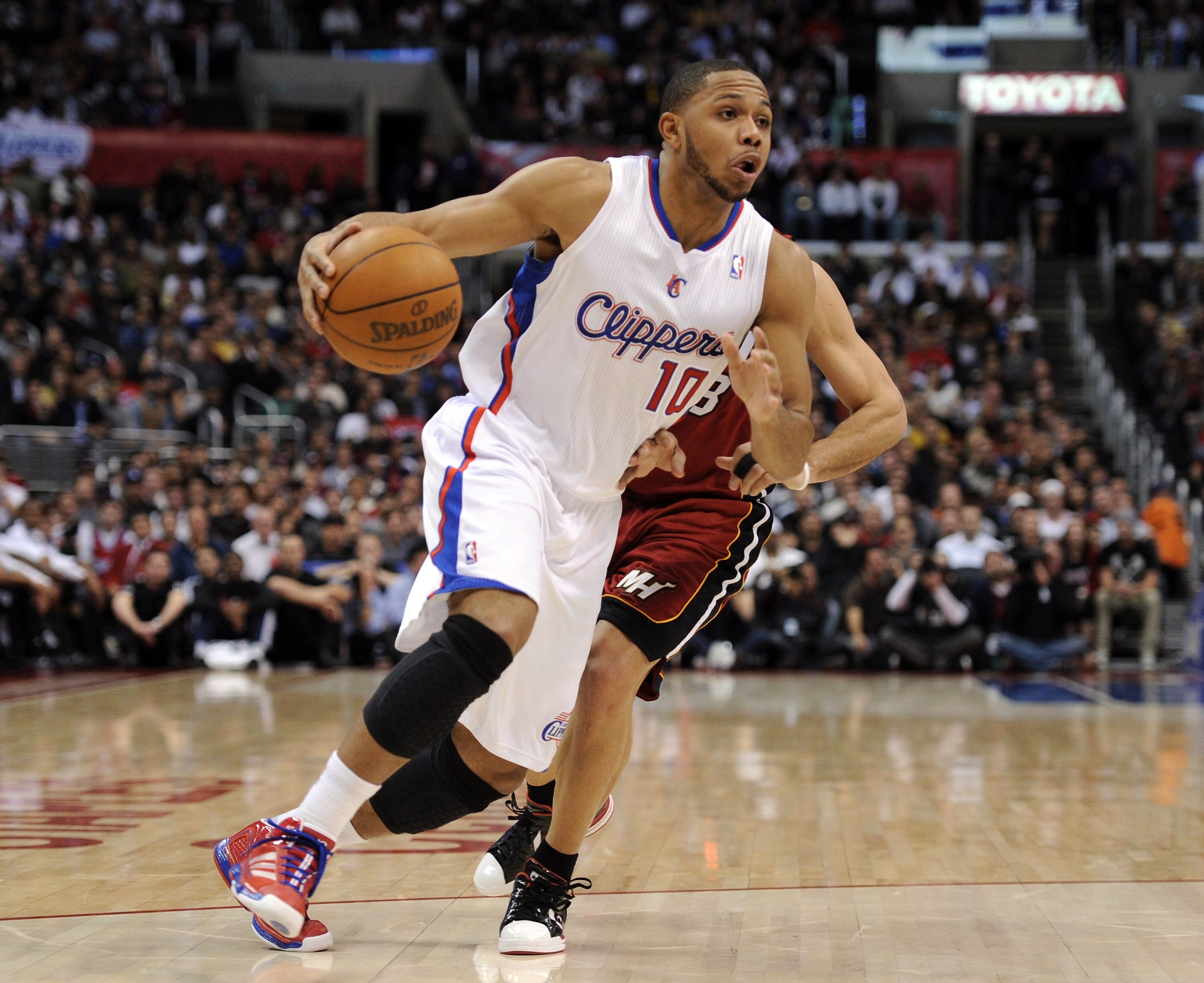 LOS ANGELES, CA - JANUARY 12:  Eric Gordon #10 of the Los Angeles Clippers heads to the basket in front of Carlos Arroyo #8 of the Miami Heat at Staples Center on January 12, 2011 in Los Angeles, California.  NOTE TO USER: User expressly acknowledges and