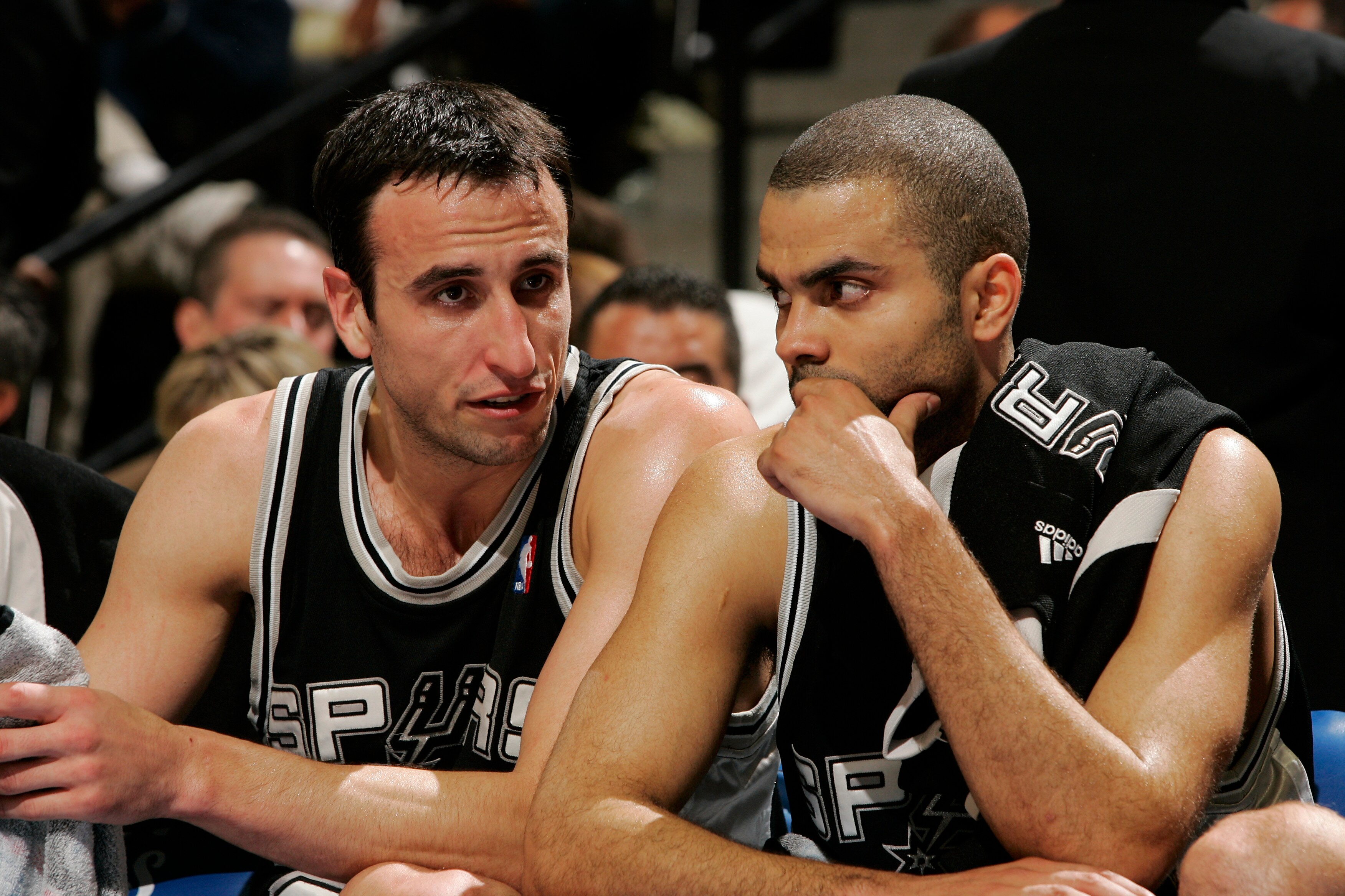 DENVER - APRIL 28:  Manu Ginobili #20 and Tony Parker #9 of the San Antonio Spurs talk on the bench during the second half of Game Three of the Western Conference Quarterfinals during the 2007 NBA Playoffs at the Pepsi Center on April 28, 2007 in Denver,