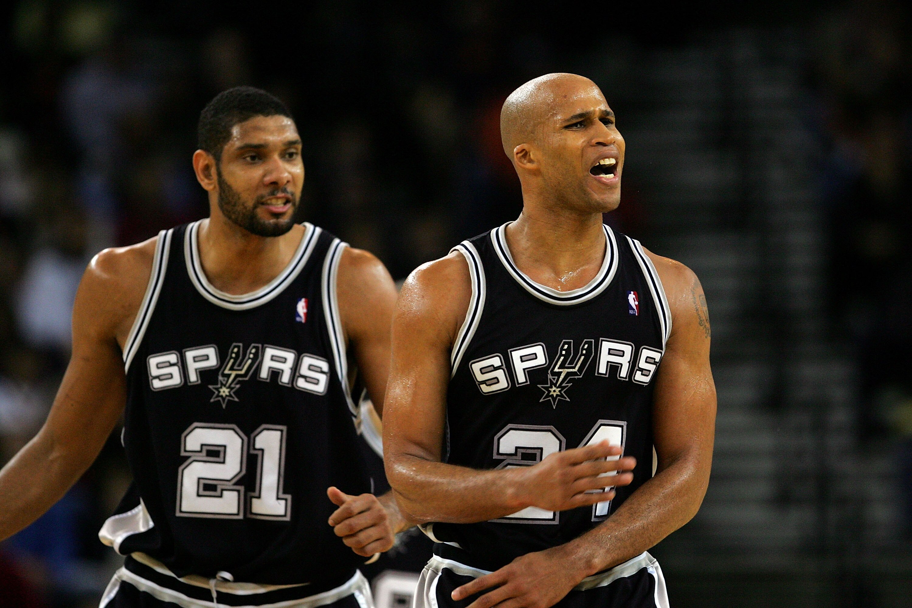 OAKLAND, CA - DECEMBER 16:  Richard Jefferson #24 and Tim Duncan #21 of the San Antonio Spurs react after Jefferson made a dunk during their game against the Golden State Warriors at Oracle Arena on December 16, 2009 in Oakland, California.  NOTE TO USER: