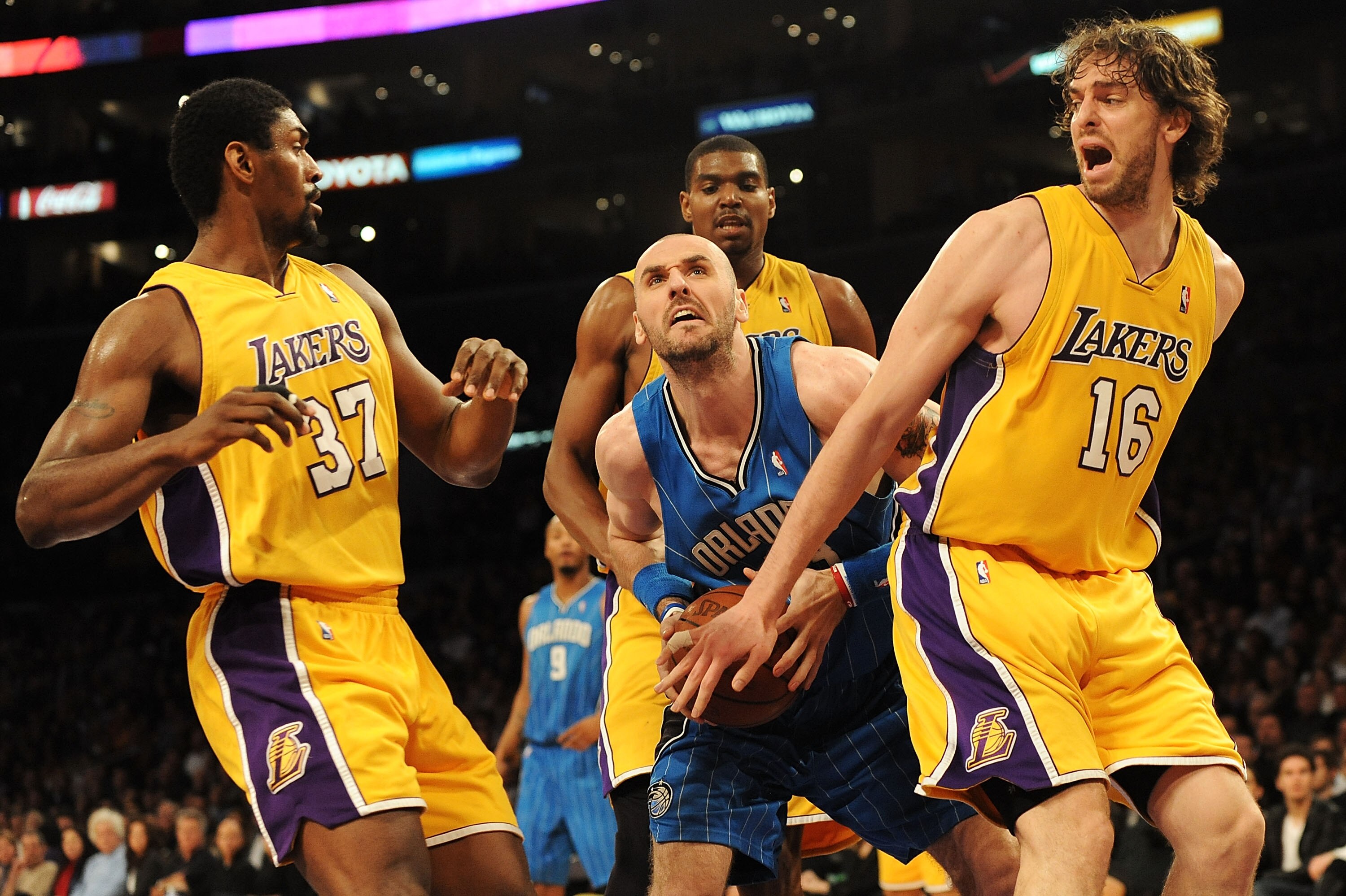 LOS ANGELES, CA - JANUARY 18:  Marcin Gortat #13 of the Orlando Magic goes to the basket against Ron Artest #37, Andrew Bynum #17 and Pau Gasol #16 of the Los Angeles Lakers in the third quarter during the game on January 18, 2010 at Staples Center in Los