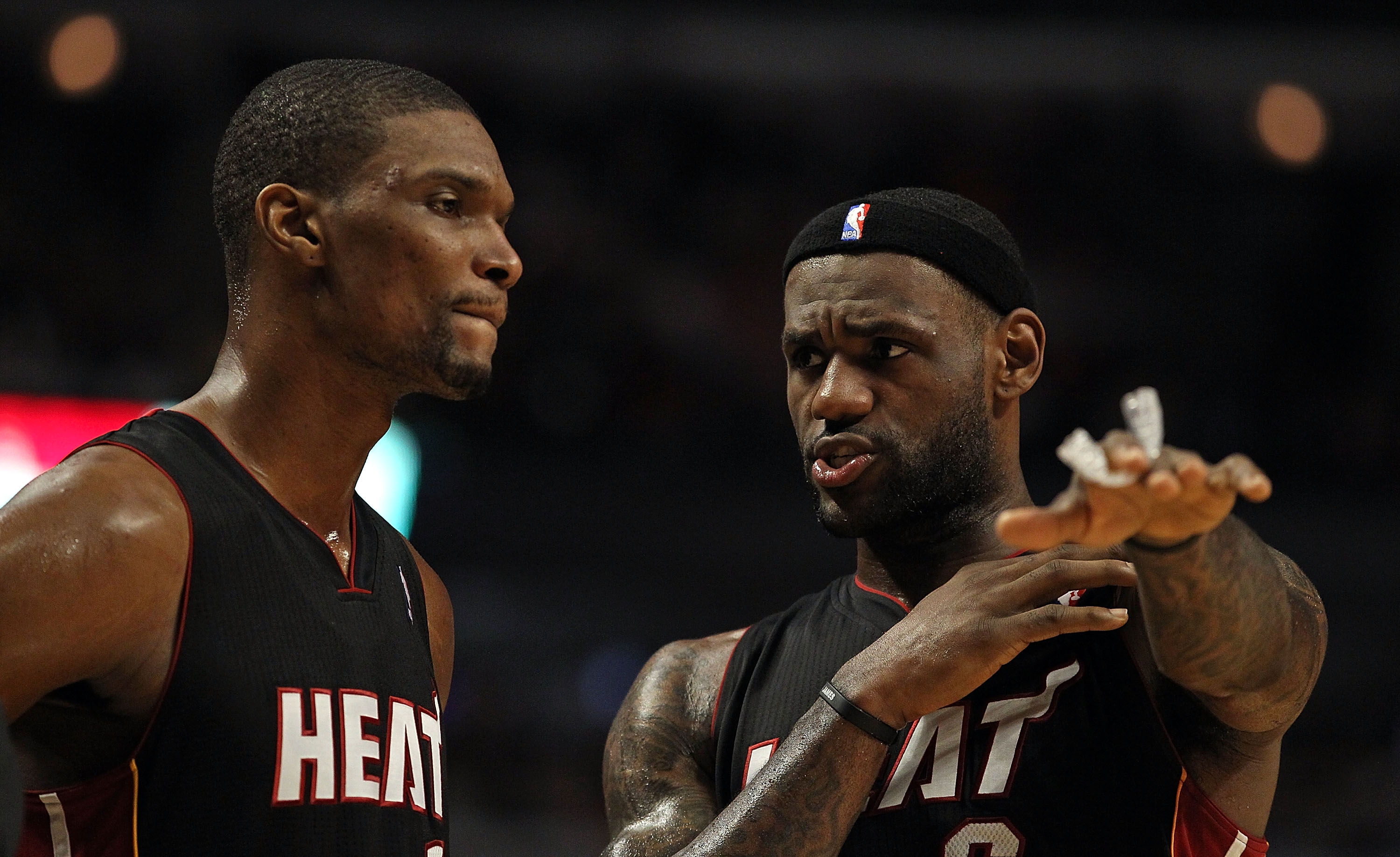 CHICAGO, IL - FEBRUARY 24: LeBron James #6 of the Miami Heat (R) talks with teammate Chris Bosh #1 during a game against the Chicago Bulls at the United Center on February 24, 2011 in Chicago, Illinois. The Bulls defeated the Heat 93-89. NOTE TO USER: Use