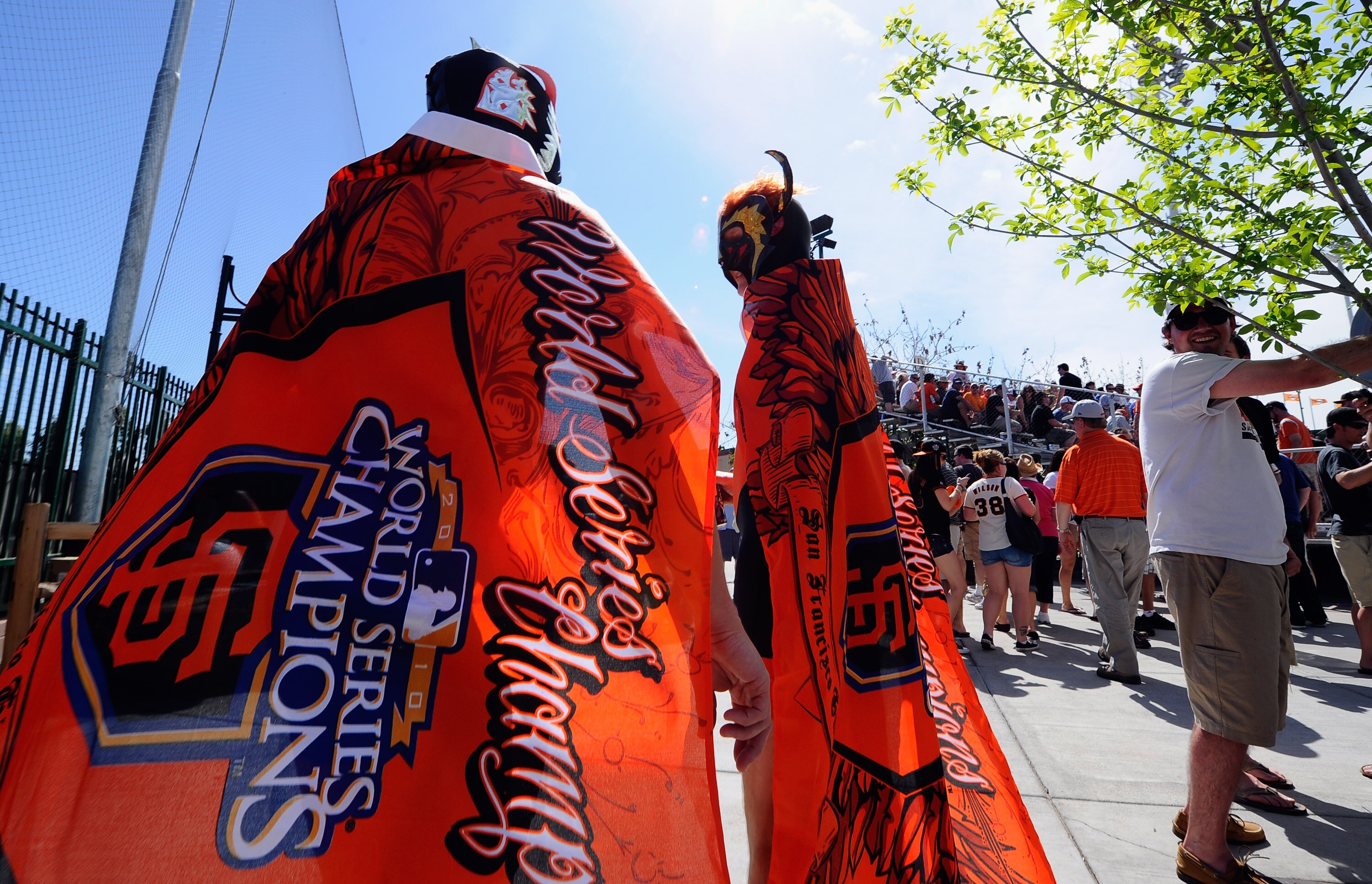 SCOTTSDALE, AZ - MARCH 18:  Couple of san Francisco Giants fans wearing Mexican wrestler Nacho Libre uniform arrive for the spring training baseball game against the Los Angeles Dodgers at of Scottsdale Stadium on March 18, 2011 in Scottsdale, Arizona.  (