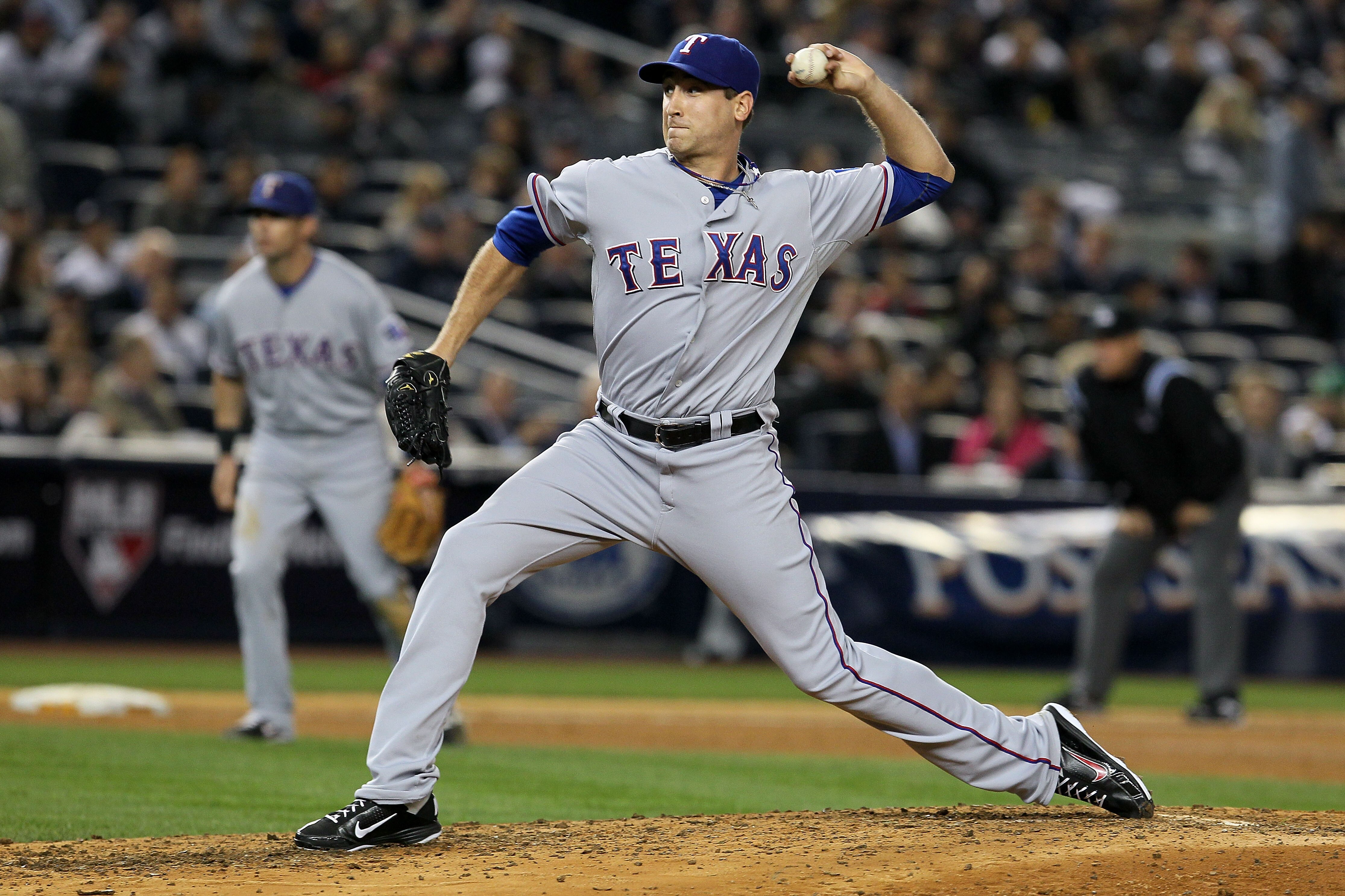 NEW YORK - OCTOBER 20:  Michael Kirkman #62 of the Texas Rangers pitches against the New York Yankees in Game Five of the ALCS during the 2010 MLB Playoffs at Yankee Stadium on October 20, 2010 in the Bronx borough of New York City.  (Photo by Jim McIsaac