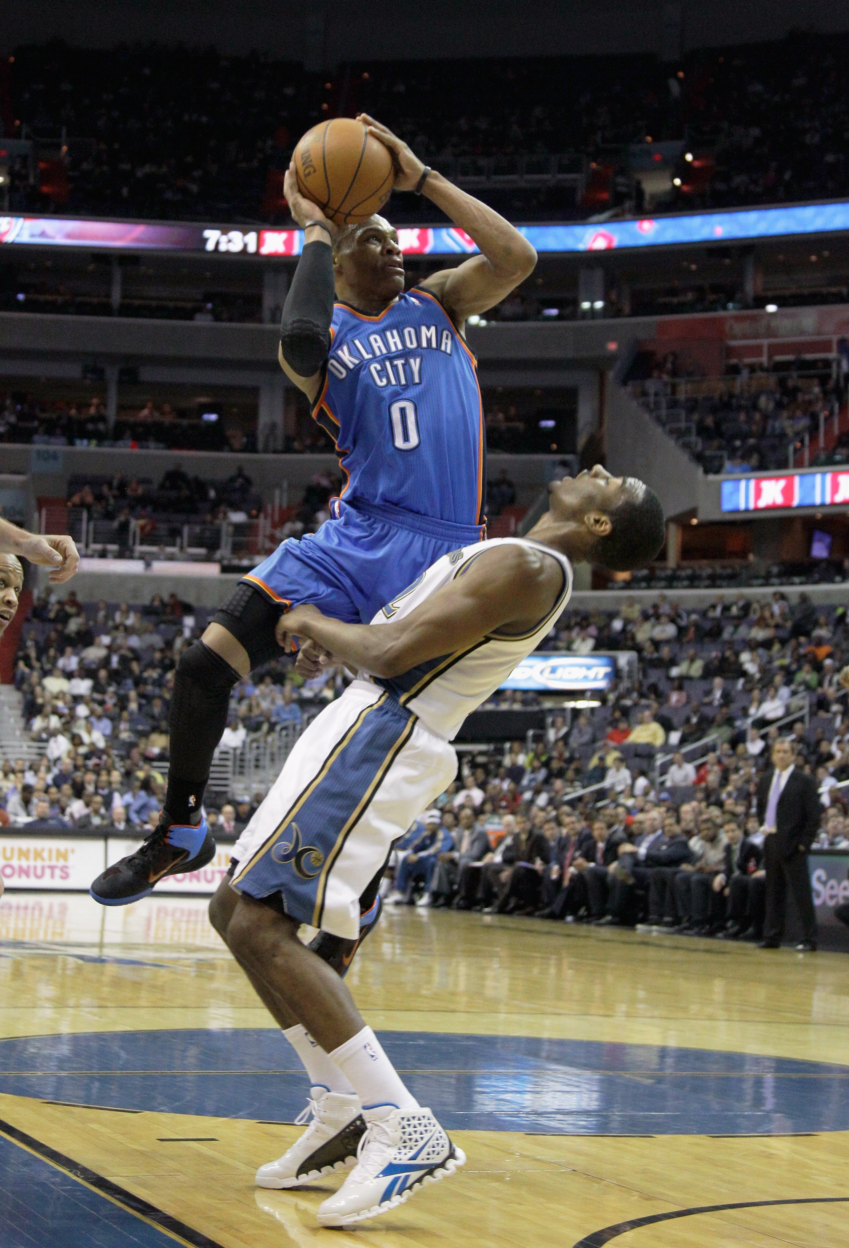 WASHINGTON, DC - MARCH 14: Russell Westbrook #0 of the Oklahoma City Thunder puts up a shot in front of John Wall #2 of the Washington WizardWashington Wizards during the first half at the Verizon Center on March 14, 2011 in Washington, DC. NOTE TO USER: