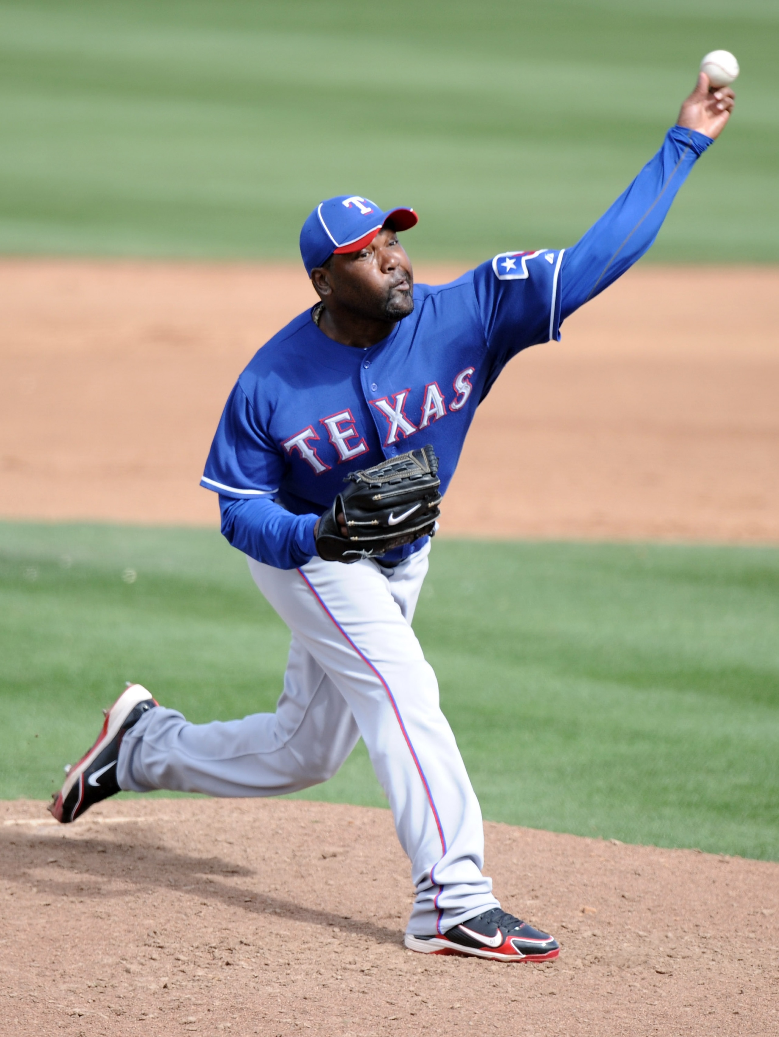 PEORIA, AZ - MARCH 01:  Arthur Rhodes #53 of the Texas Rangers pitches against the Seattle Mariners during spring training at Peoria Stadium on March 1, 2011 in Peoria, Arizona.  (Photo by Harry How/Getty Images)