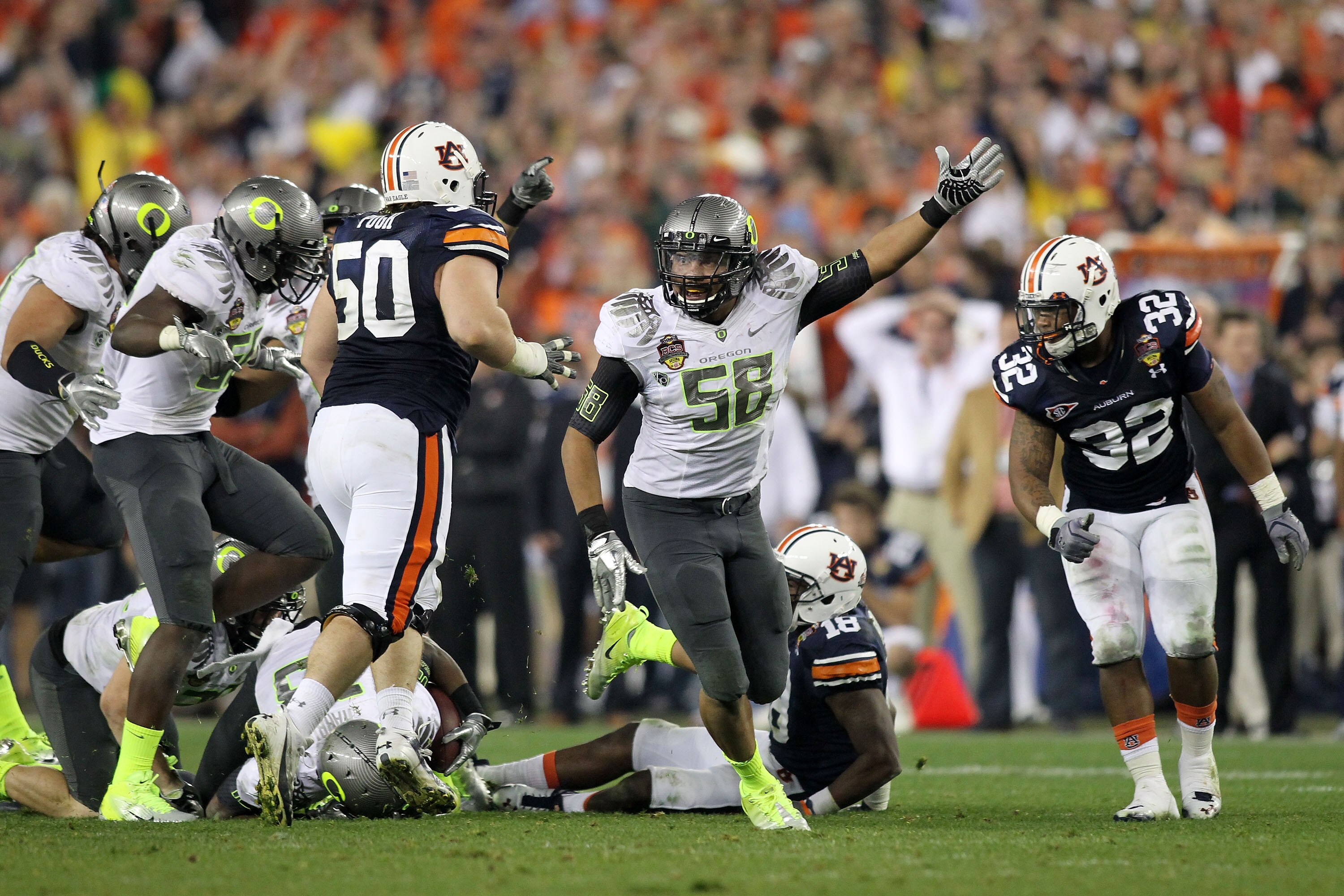 GLENDALE, AZ - JANUARY 10:  Kenny Rowe #58 of the Oregon Ducks reacts during their game against the Auburn Tigers during the Tostitos BCS National Championship Game at University of Phoenix Stadium on January 10, 2011 in Glendale, Arizona.  (Photo by Jona