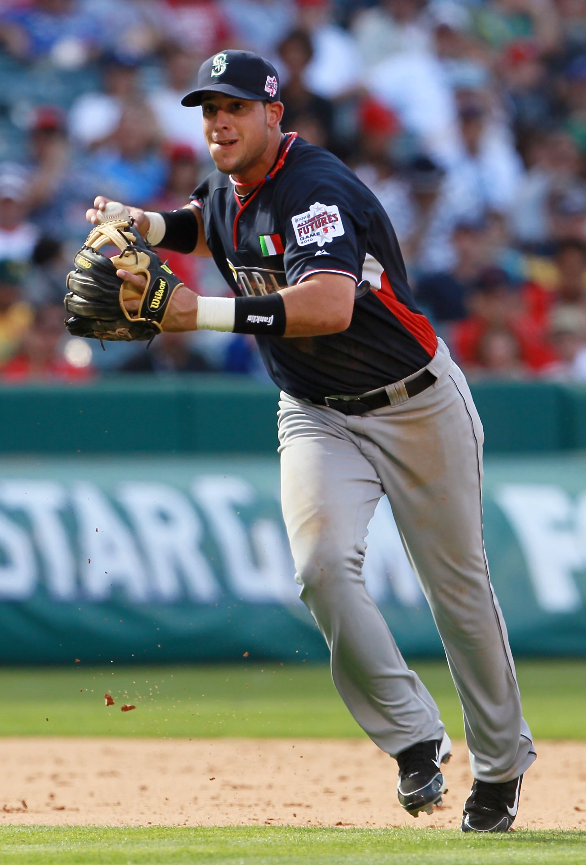 ANAHEIM, CA - JULY 11:  World Futures All-Star Alex Liddi #10 of the Seattle Mariners looks to throw during the 2010 XM All-Star Futures Game at Angel Stadium of Anaheim on July 11, 2010 in Anaheim, California.  (Photo by Jeff Gross/Getty Images)