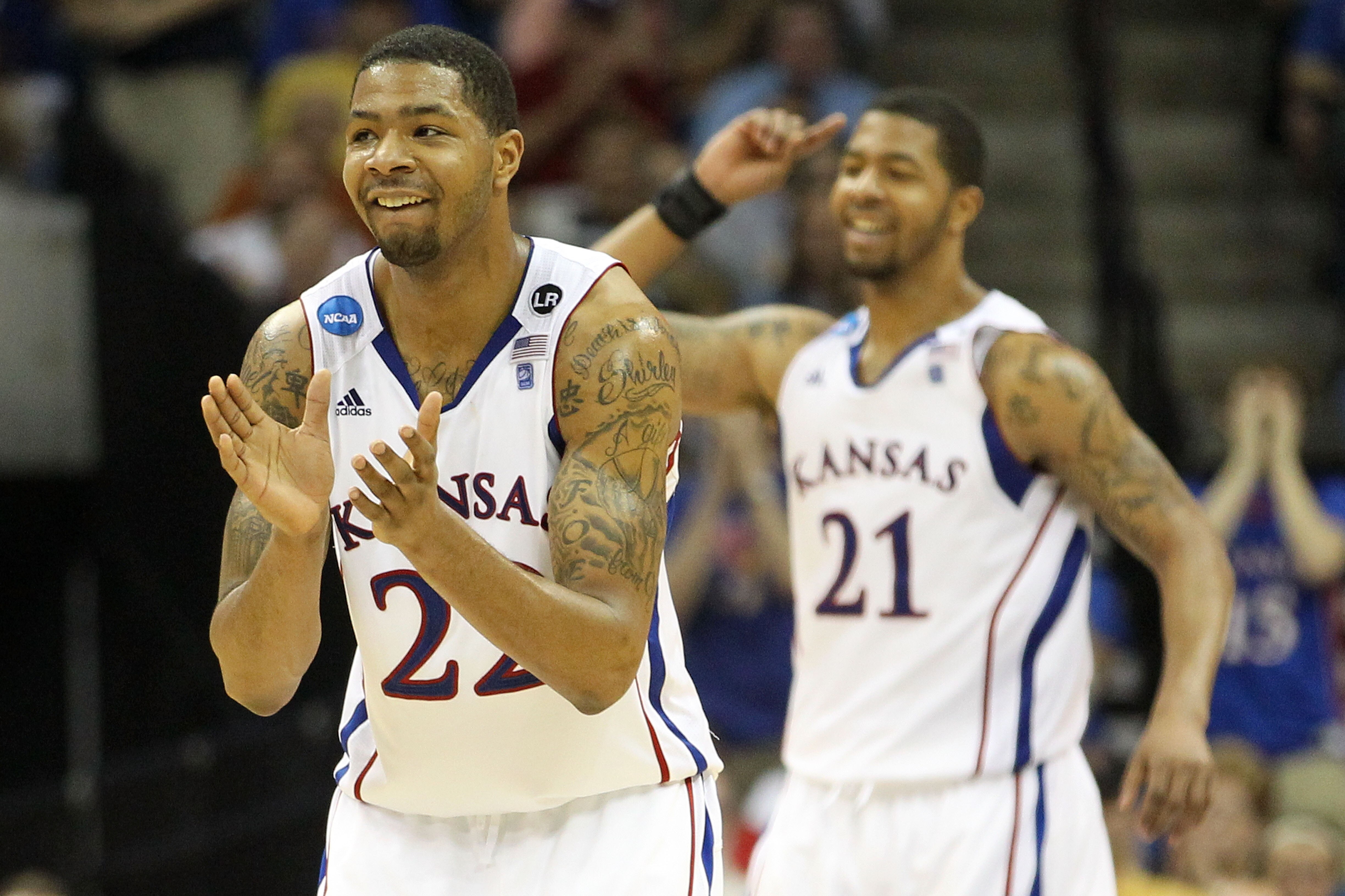 TULSA, OK - MARCH 20: Marcus Morris #22 and Markieff Morris #21 of the Kansas Jayhawks celebrate after a play against the Illinois Fighting Illini during the third round of the 2011 NCAA men's basketball tournament at BOK Center on March 20, 2011 in Tuls TULSA, OK - MARCH 20: Marcus Morris #22 and Markieff Morris #21 of the Kansas Jayhawks celebrate after a play against the Illinois Fighting Illini during the third round of the 2011 NCAA men's basketball tournament at BOK Center on March 20, 2011 in Tuls