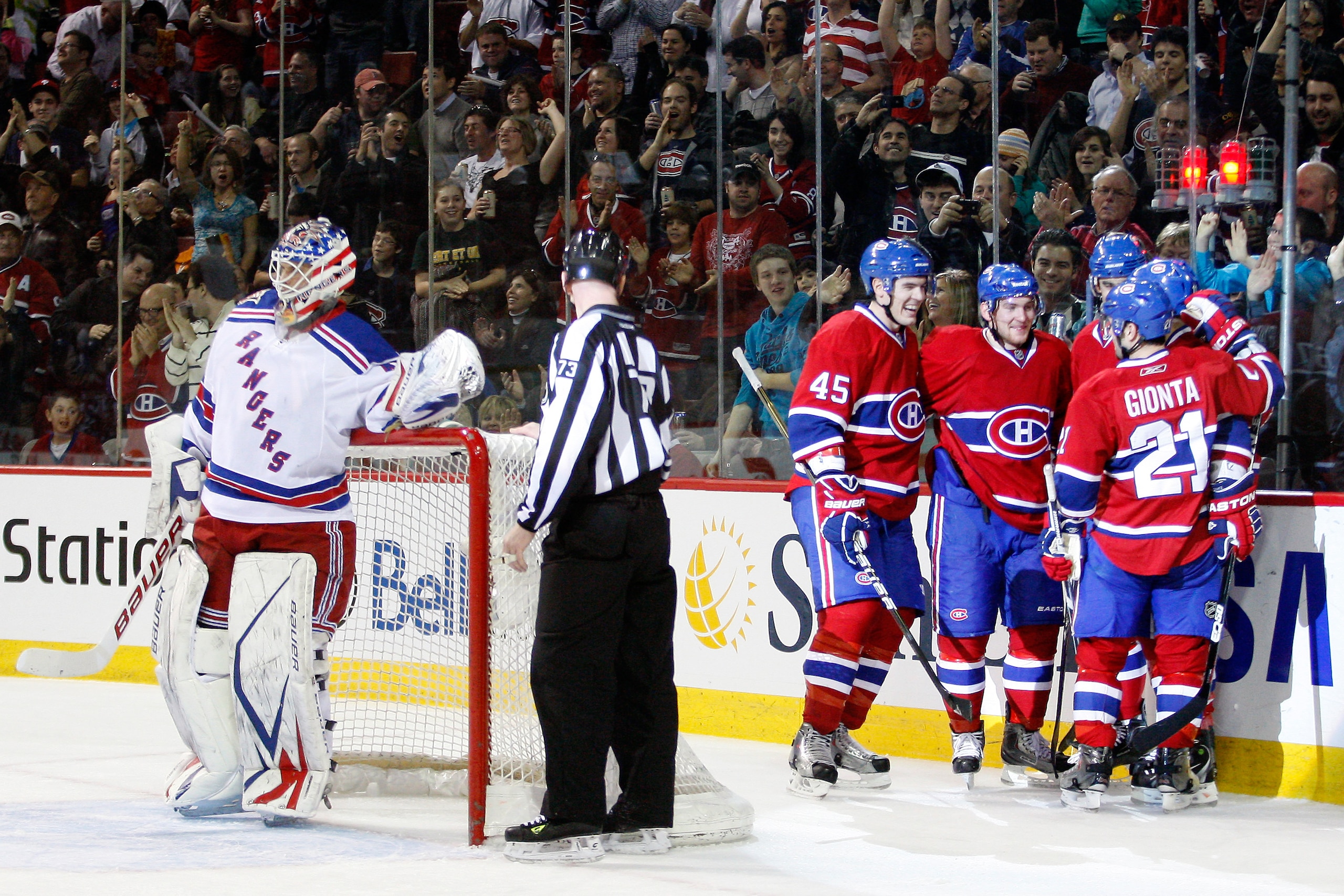 MONTREAL, CANADA - FEBRUARY 5:  Members of the Montreal Canadiens celebrate the second period goal by team mate Scott Gomez #11 during the NHL game against the New York Rangers at the Bell Centre on February 5, 2011 in Montreal, Quebec, Canada.  (Photo by