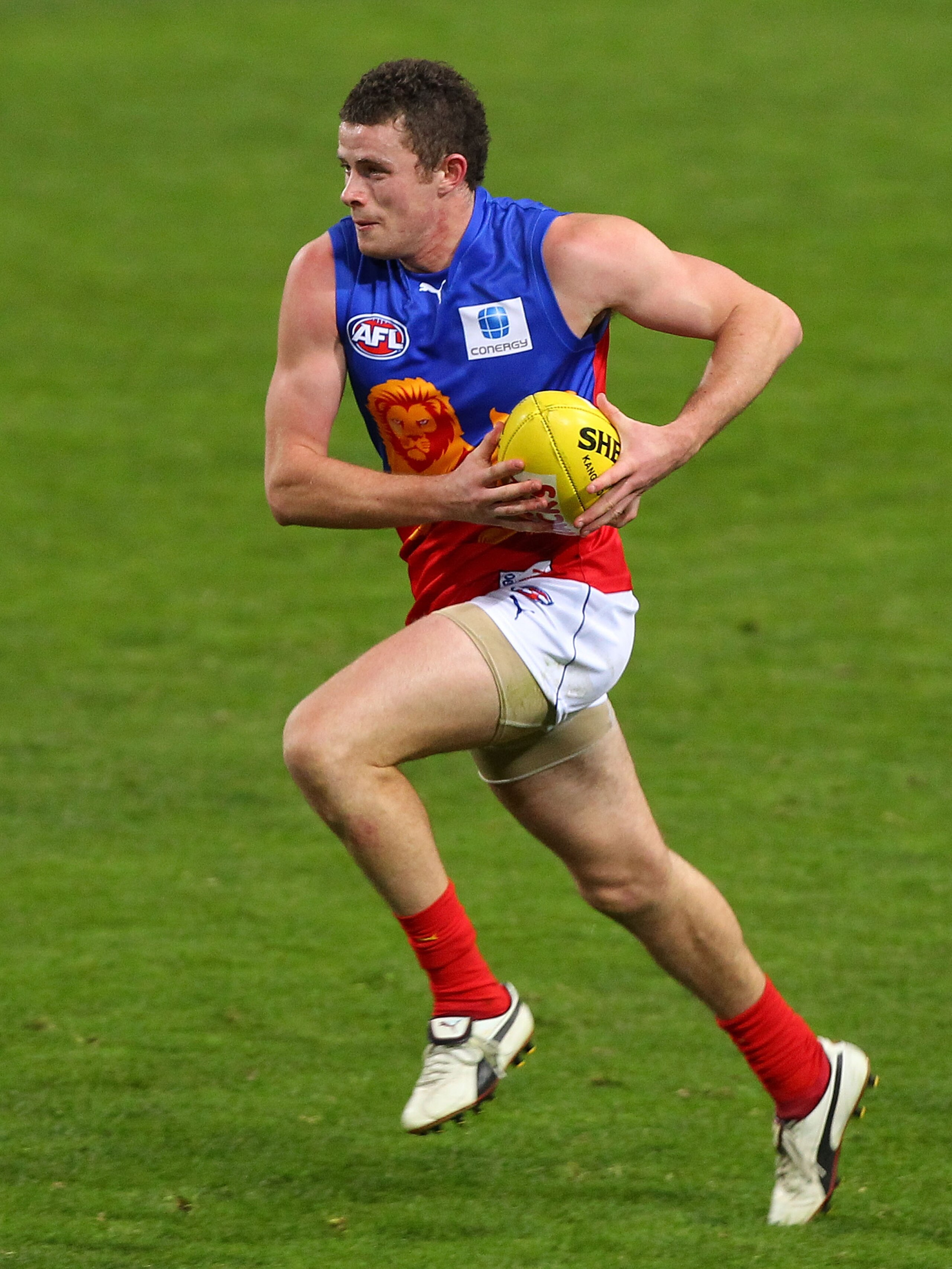 PERTH, AUSTRALIA - AUGUST 07:  Tom Rockliff of the Lions runs with the ball during the round 19 AFL match between the West Coast Eagles and the Brisbane Lions at Subiaco Oval on August 7, 2010 in Perth, Australia.  (Photo by Paul Kane/Getty Images)