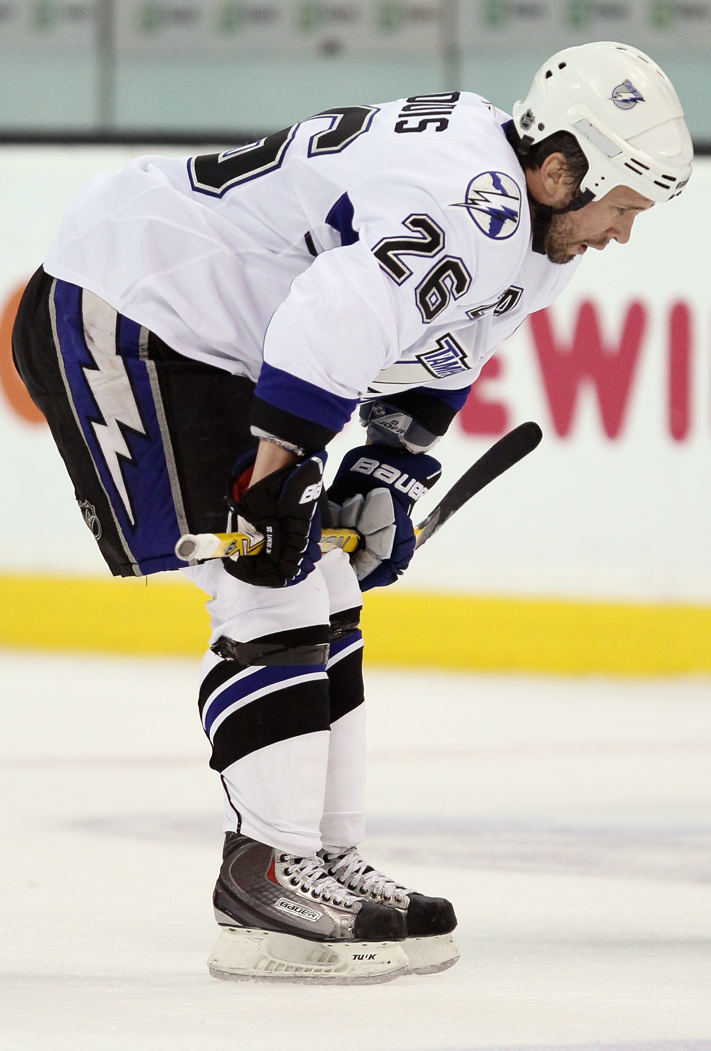 BOSTON, MA - MARCH 03:  Martin St. Louis #26 of the Tampa Bay Lightning heads for the locker room after the game against he Boston Bruins on March 3, 2011 at the TD Garden in Boston, Massachusetts. The Boston Bruins defeated the Tampa Bay Lightning 2-1.
