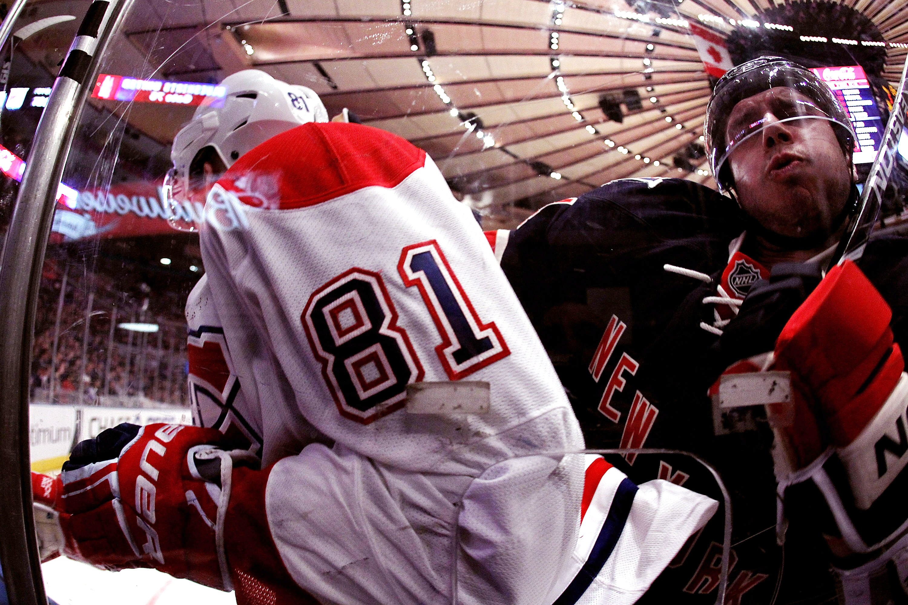 NEW YORK - MARCH 18:  Steve Eminger #44 of the New York Rangers checks Lars Eller #81 of the Montreal Canadiens during their game on March 18, 2011 at Madison Square Garden in New York City, New York.  (Photo by Al Bello/Getty Images)