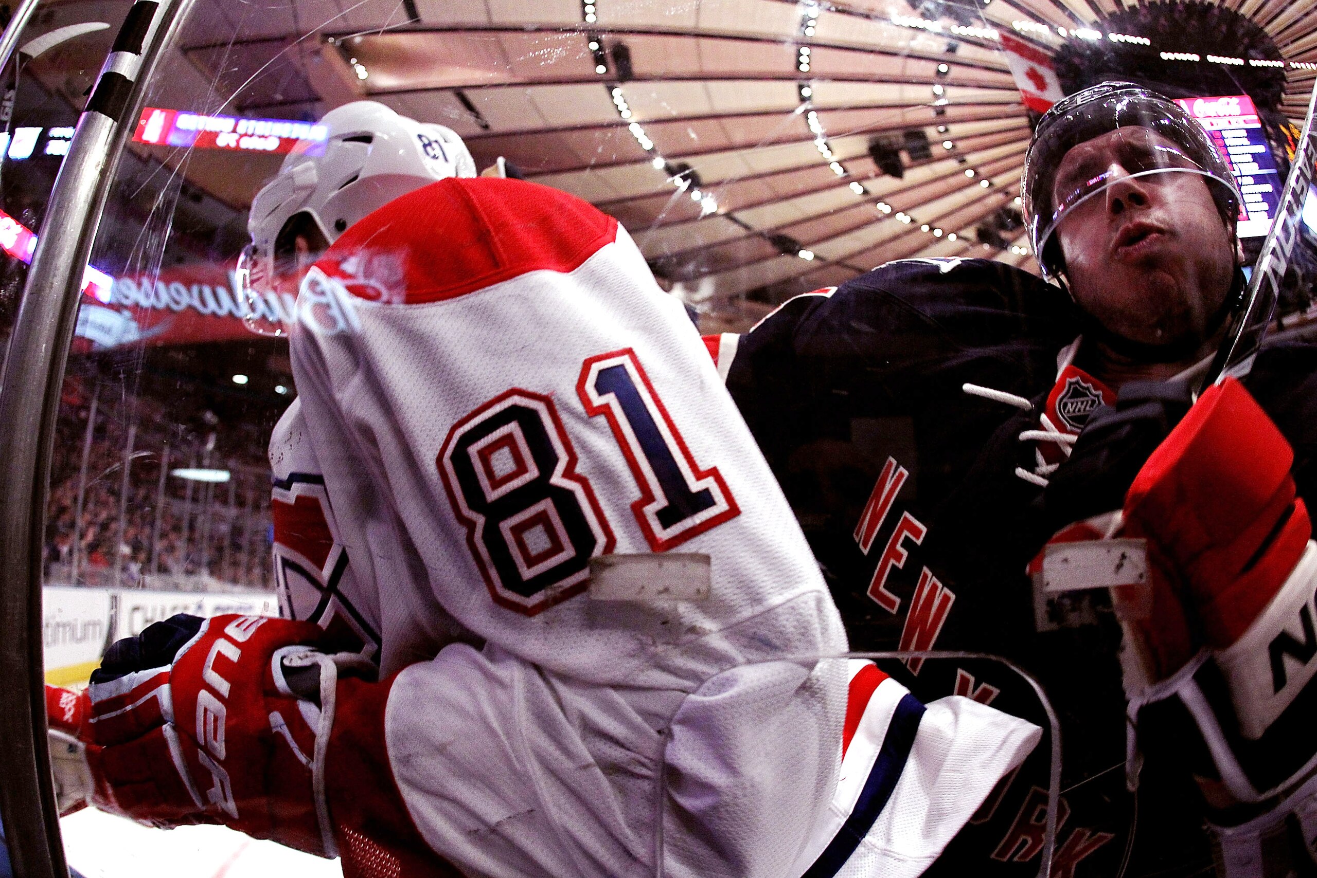 NEW YORK - MARCH 18:  Steve Eminger #44 of the New York Rangers checks Lars Eller #81 of the Montreal Canadiens during their game on March 18, 2011 at Madison Square Garden in New York City, New York.  (Photo by Al Bello/Getty Images)