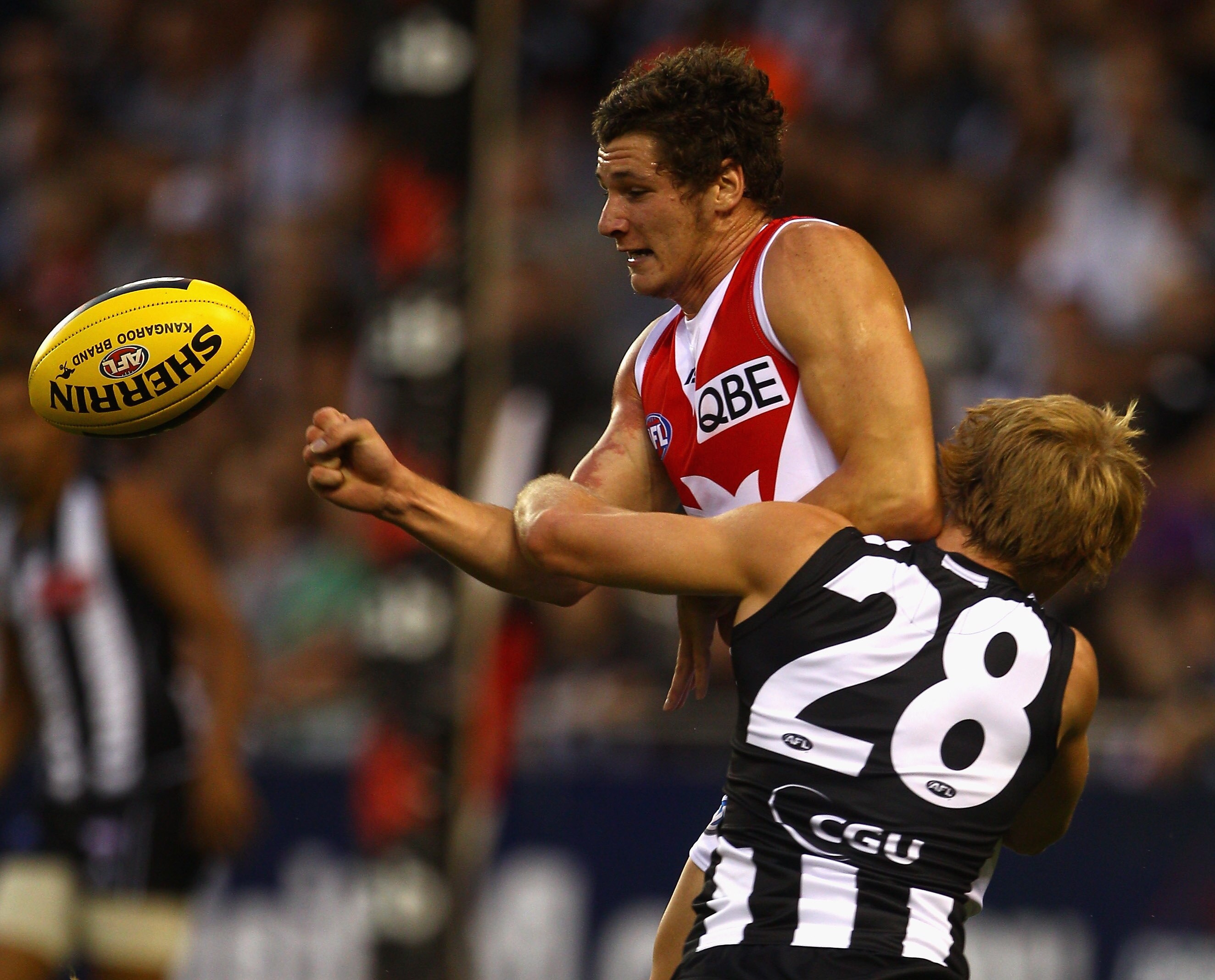 MELBOURNE, AUSTRALIA - FEBRUARY 25:   Andrejs Everitt of the Swans is tackled by Ben Sinclair of the Magpies during the NAB Cup Quarter Final match between the Collingwood Magpies and the Sydney Swans at Etihad Stadium on February 25, 2011 in Melbourne, A