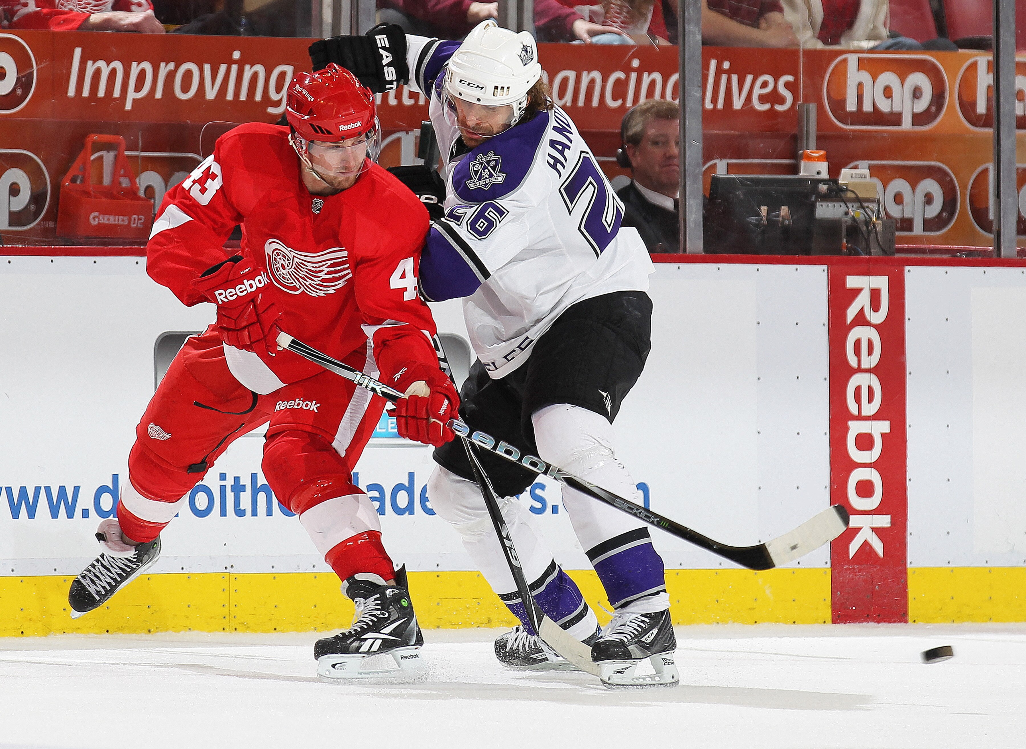 DETROIT, MI - MARCH 9:  Michal Handzus #26 of the Los Angeles Kings tries to check Darren Helm #43 of the Detroit Red Wings before he can get a pass away in a game on March 9, 2011 at the Joe Louis Arena in Detroit, Michigan. The Kings defeated the Wings