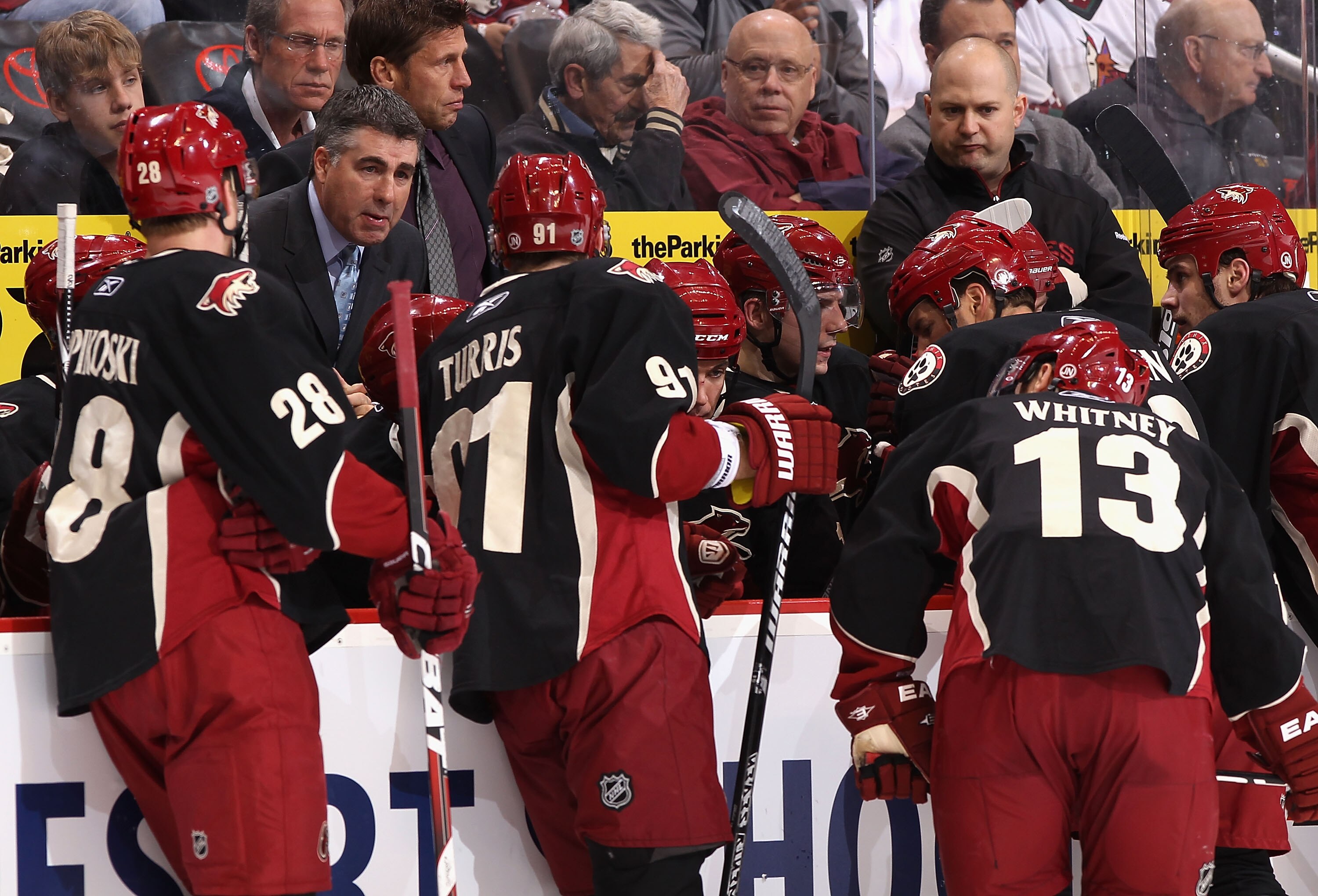 GLENDALE, AZ - MARCH 22:  Head coach Dave Tippett of the Phoenix Coyotes speaks with his team during a time out from the NHL game against the St. Louis Blues at Jobing.com Arena on March 22, 2011 in Glendale, Arizona. The Coyotes defeated the Blues 2-1.