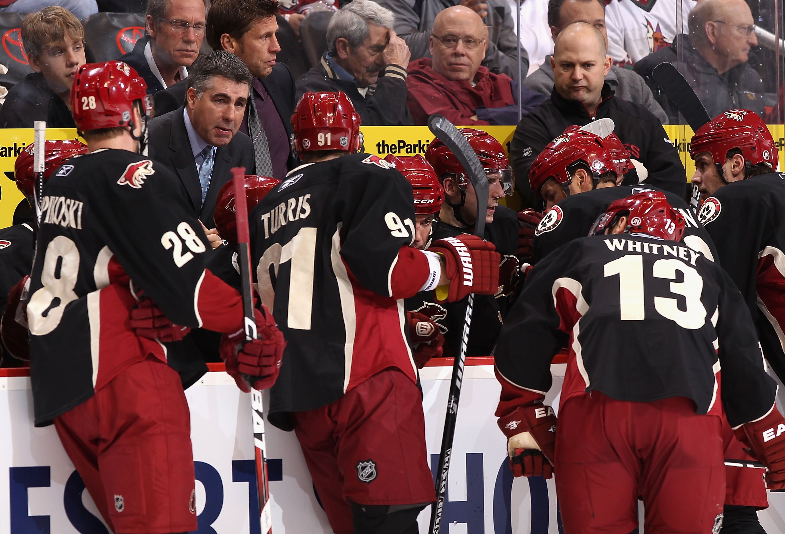 GLENDALE, AZ - MARCH 22:  Head coach Dave Tippett of the Phoenix Coyotes speaks with his team during a time out from the NHL game against the St. Louis Blues at Jobing.com Arena on March 22, 2011 in Glendale, Arizona. The Coyotes defeated the Blues 2-1.