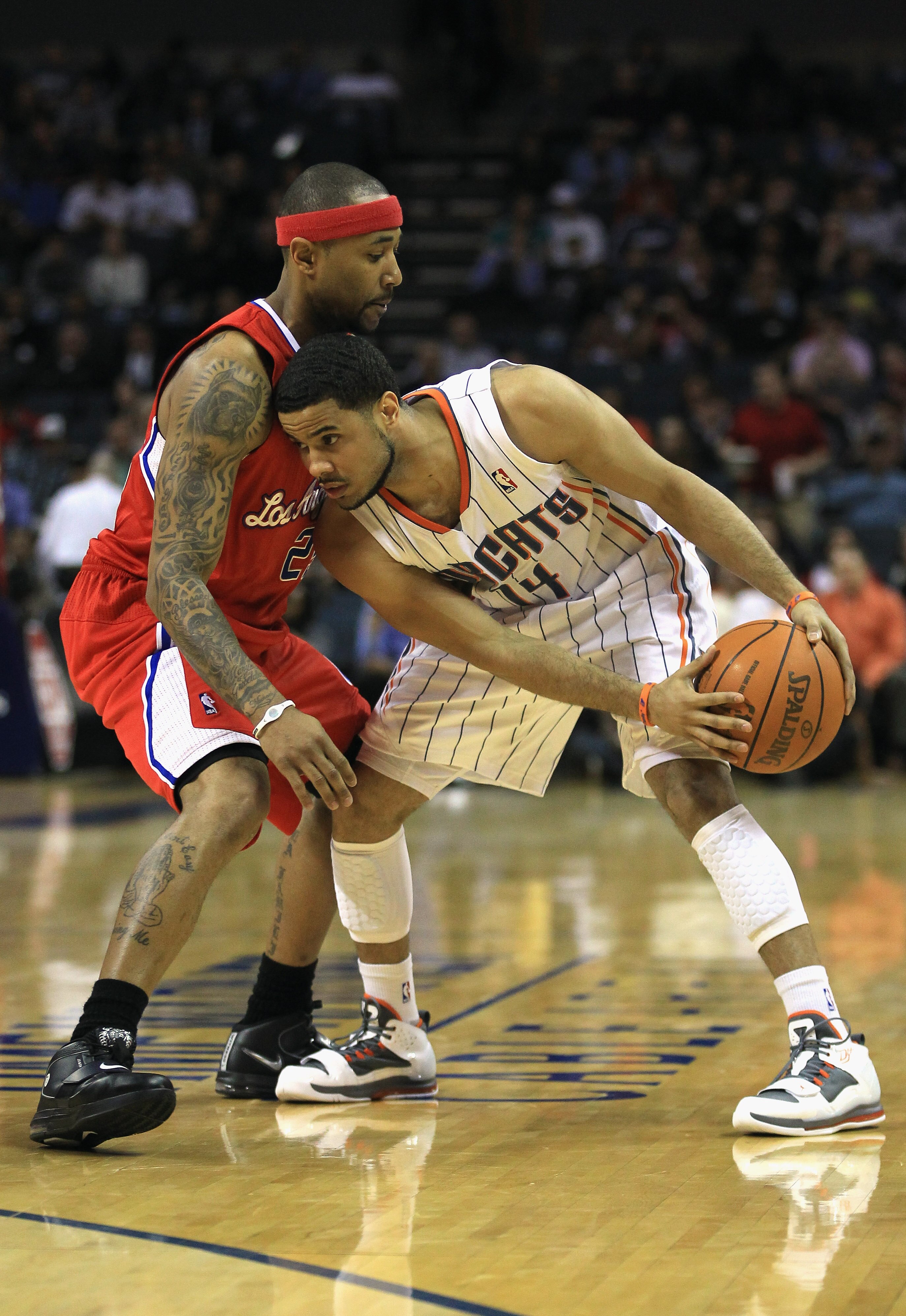 CHARLOTTE, NC - MARCH 07:  Mo Williams #25 of the Los Angeles Clippers guards D.J. Augustin #14 of the Charlotte Bobcats during their game at Time Warner Cable Arena on March 7, 2011 in Charlotte, North Carolina. NOTE TO USER: User expressly acknowledges