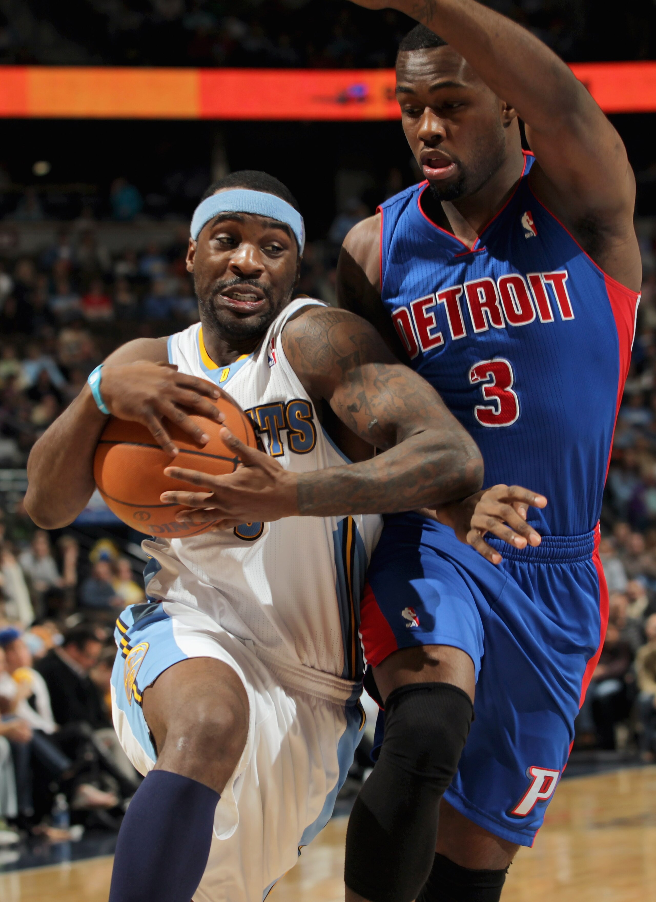 DENVER, CO - MARCH 12:  Ty Lawson #3 of the Denver Nuggets drives to the basket against the defense of Rodney Stuckey #3 of the Detroit Pistons at the Pepsi Center on March 12, 2011 in Denver, Colorado. The Nuggets defeated the Pistons 131-101.  NOTE TO U