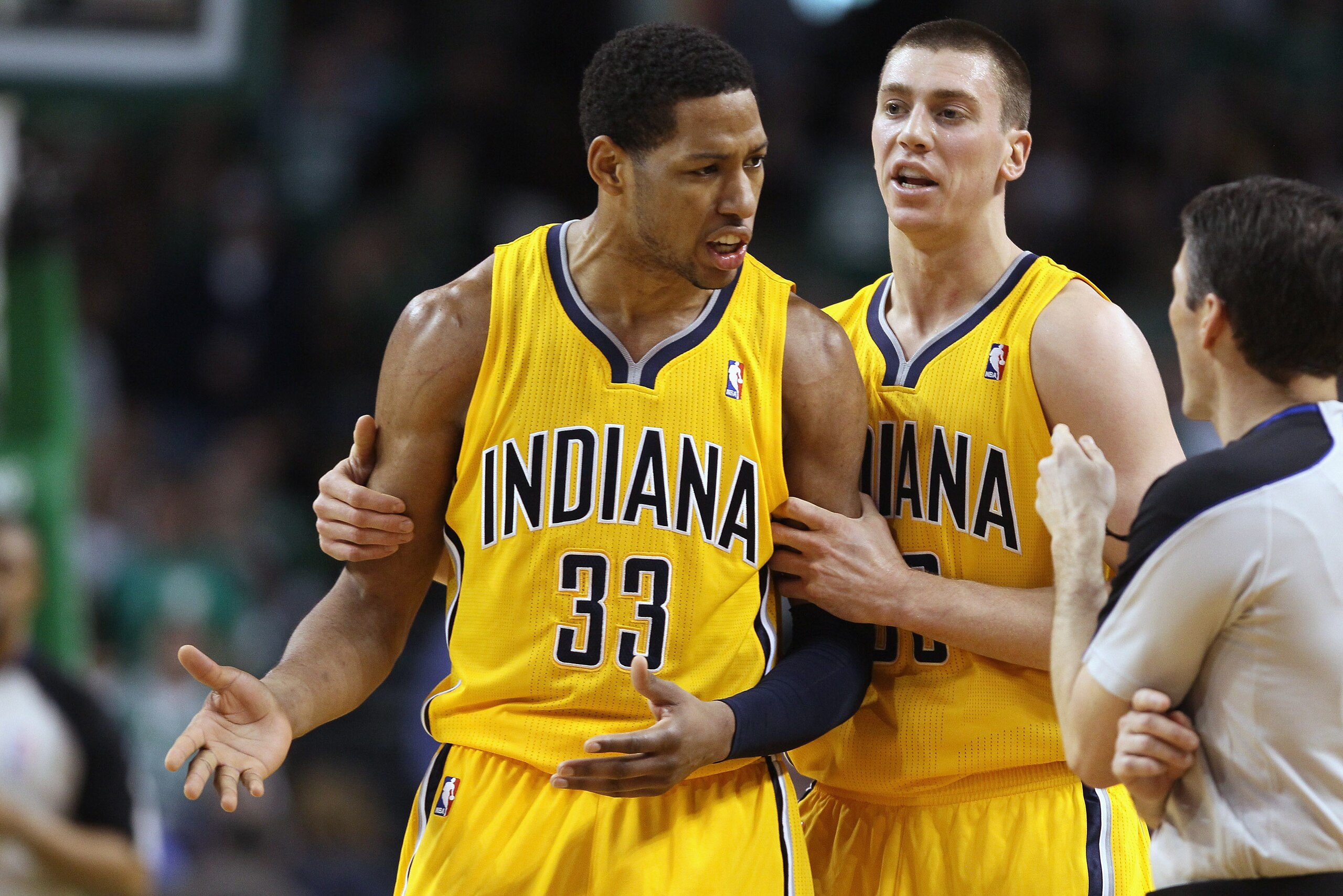 BOSTON, MA - MARCH 16:  Danny Granger #33 is pulled away from the referee by teamamte Tyler Hansbrough #50 of the Indiana Pacers on March 16, 2011 at the TD Garden in Boston, Massachusetts. Granger was called for a techical foul. The Celtics defeated the