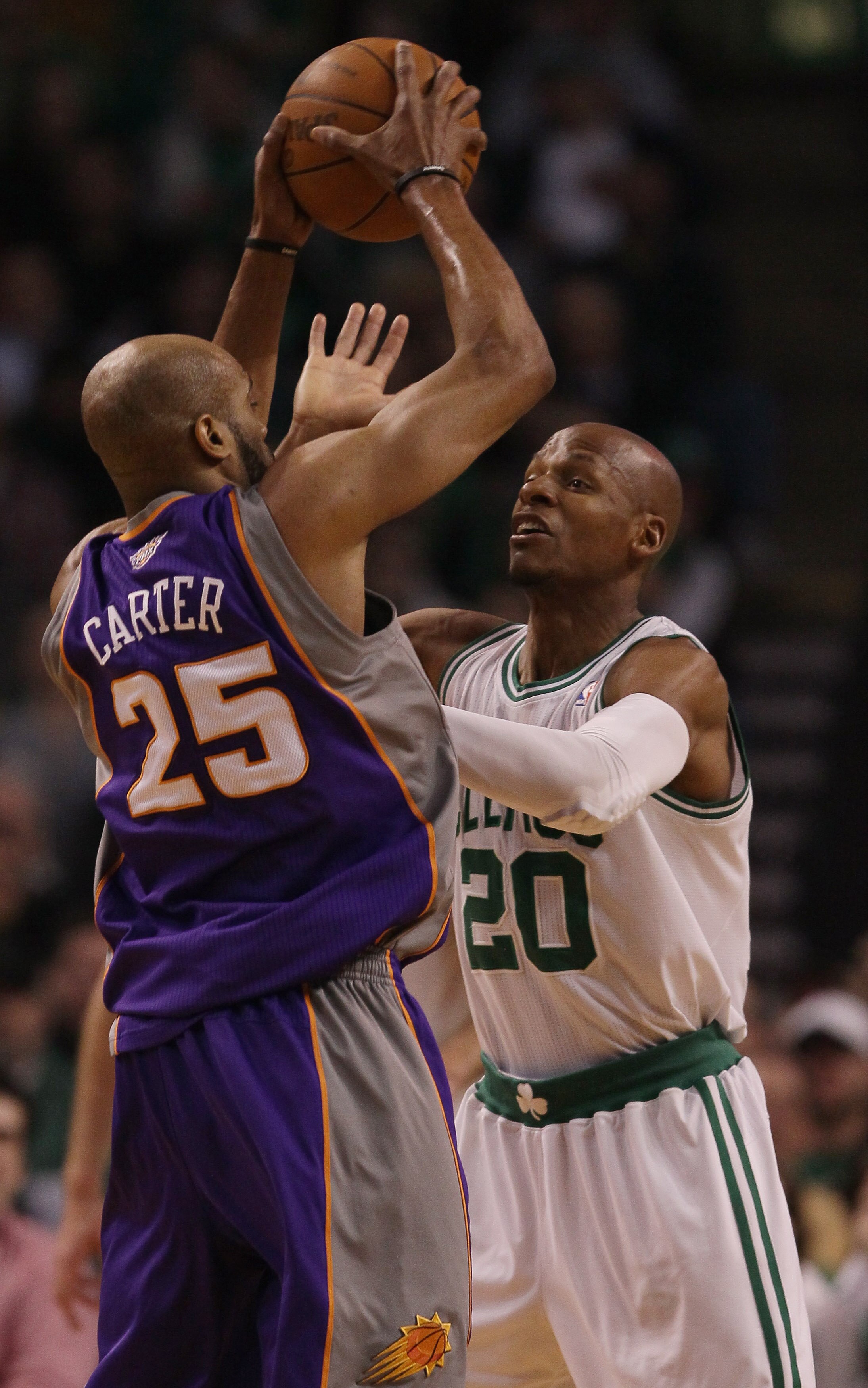 BOSTON, MA - MARCH 02:  Ray Allen #20 of the Boston Celtics defends as Vince Carter #25 of the Phoenix Suns tries to pass the ball on March 2, 2011 at the TD Garden in Boston, Massachusetts.  NOTE TO USER: User expressly acknowledges and agrees that, by d