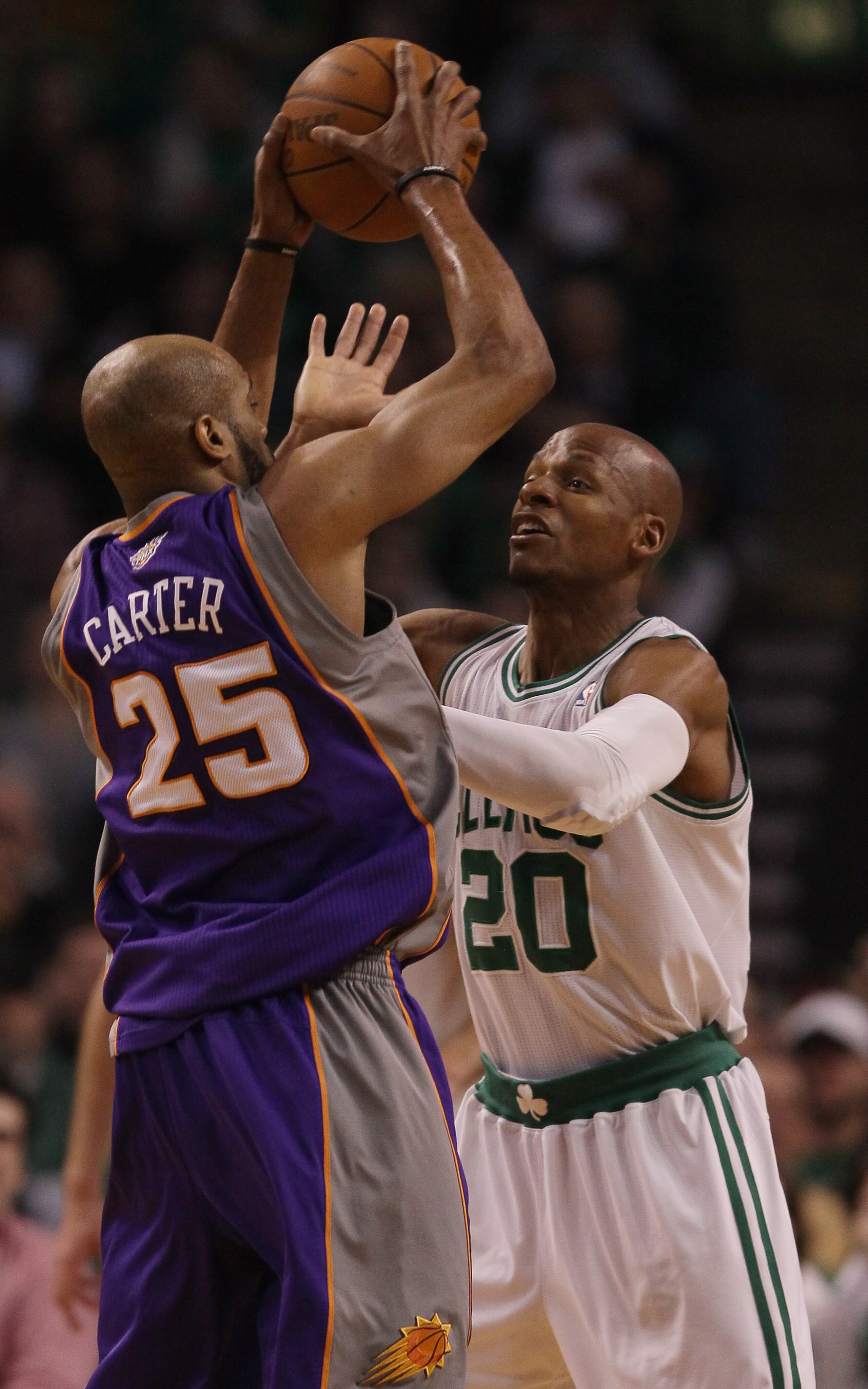 BOSTON, MA - MARCH 02:  Ray Allen #20 of the Boston Celtics defends as Vince Carter #25 of the Phoenix Suns tries to pass the ball on March 2, 2011 at the TD Garden in Boston, Massachusetts.  NOTE TO USER: User expressly acknowledges and agrees that, by d