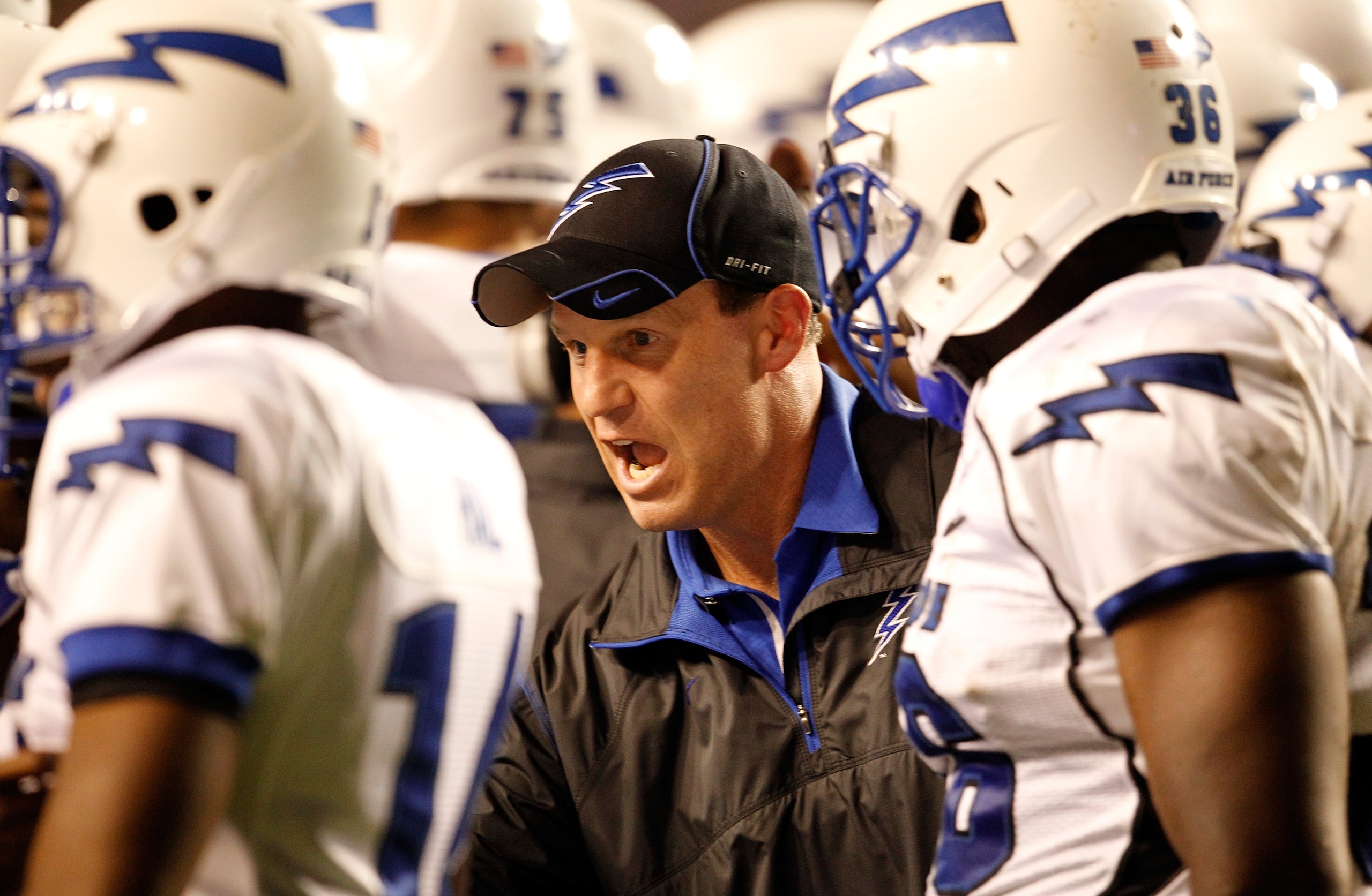FORT WORTH, TX - OCTOBER 23:  Head coach Troy Calhoun of the Air Force Falcons leads his team on the field against the TCU Horned Frogs at Amon G. Carter Stadium on October 23, 2010 in Fort Worth, Texas.  (Photo by Tom Pennington/Getty Images)